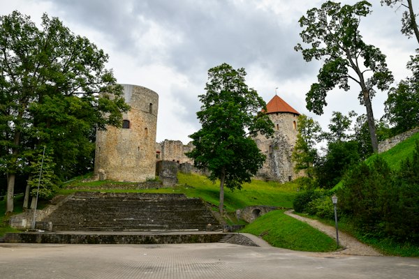 Ancient stone castle ruins on a grassy hill — Cēsis, Latvia