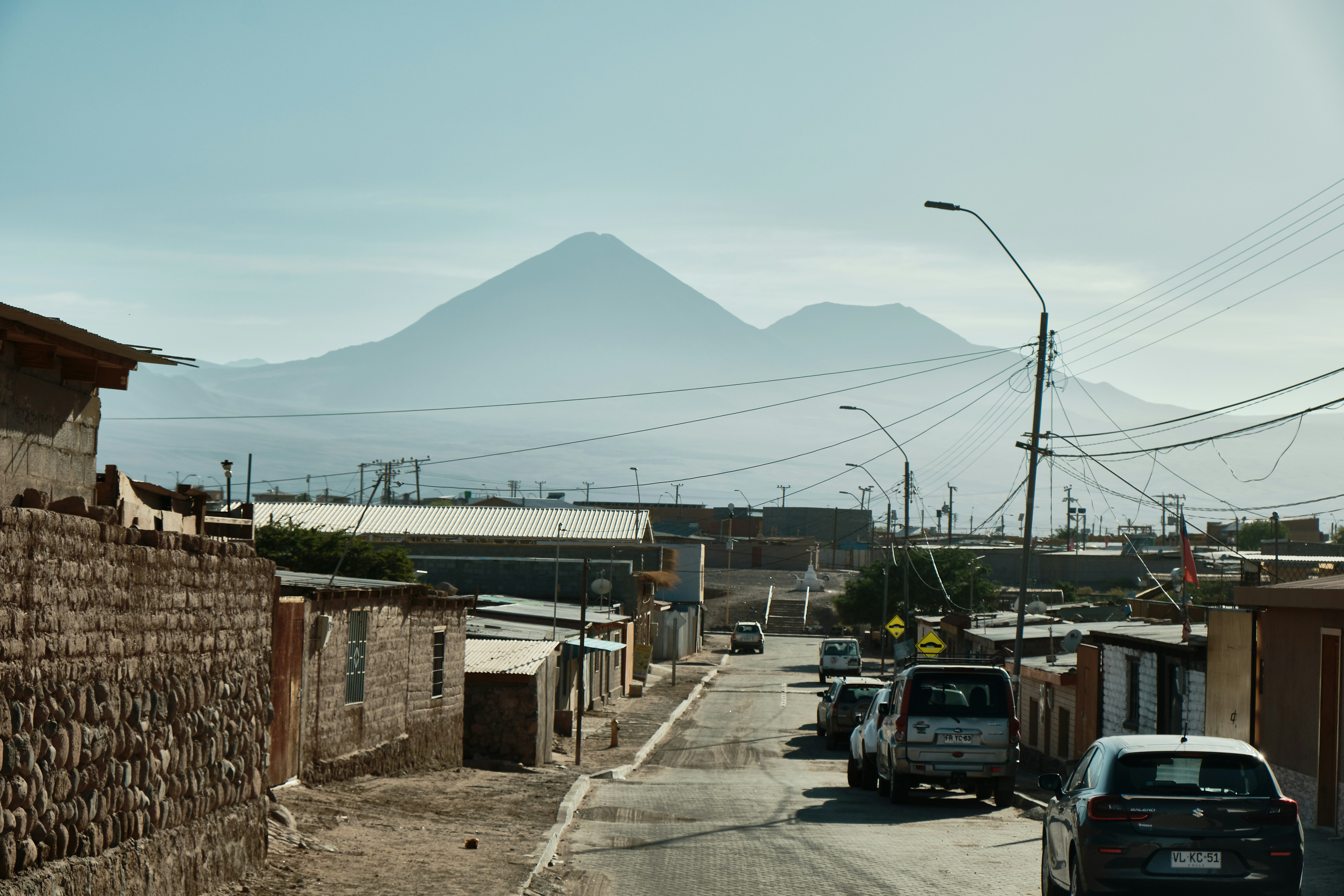Street view with distant mountains under a clear sky