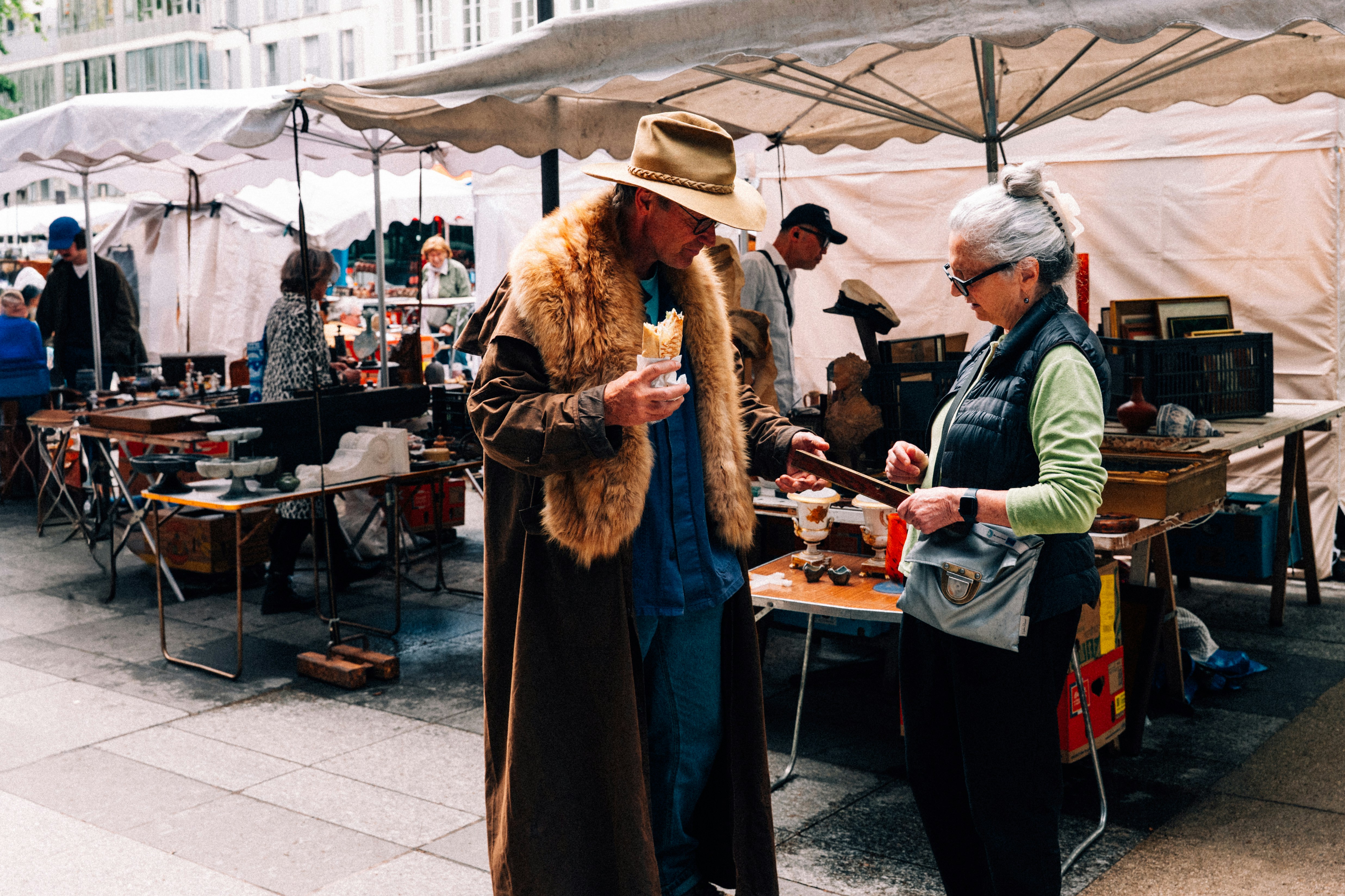 Couple browsing items at an outdoor market