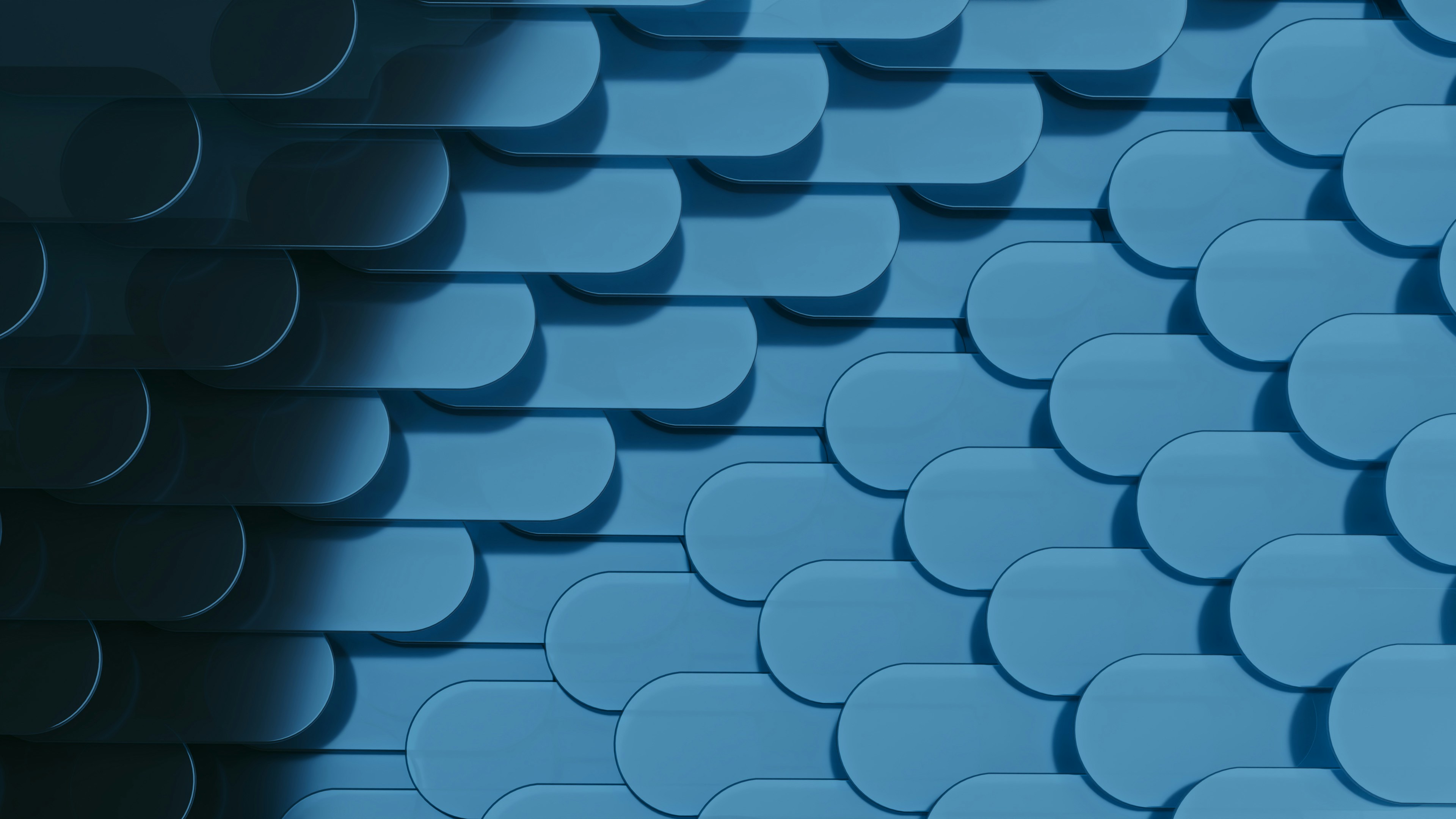 A repeating pattern of rounded blue tiles
