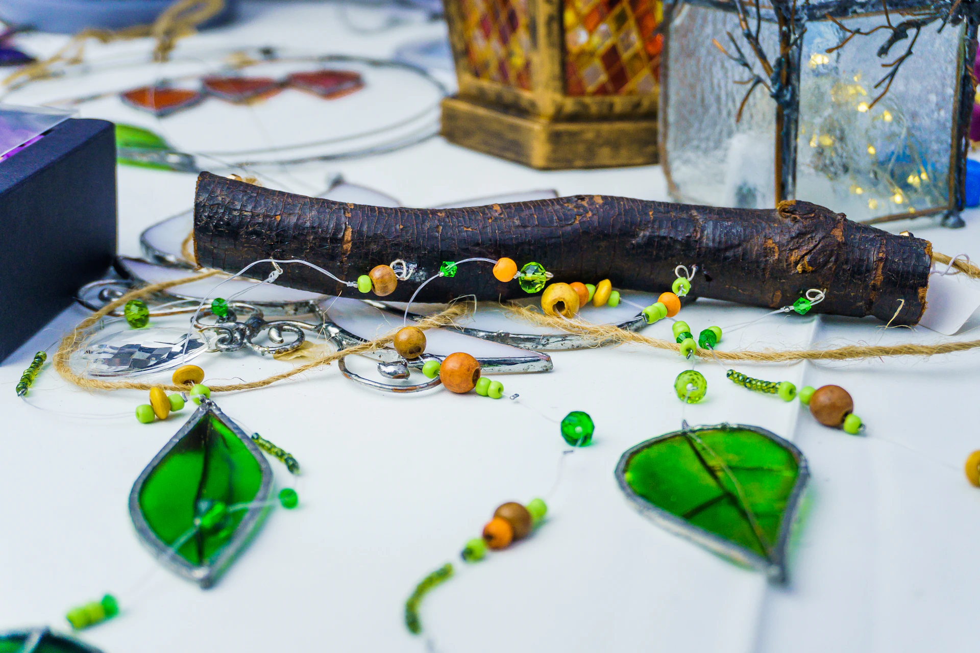 Handmade crafts with wooden beads and green leaf charms