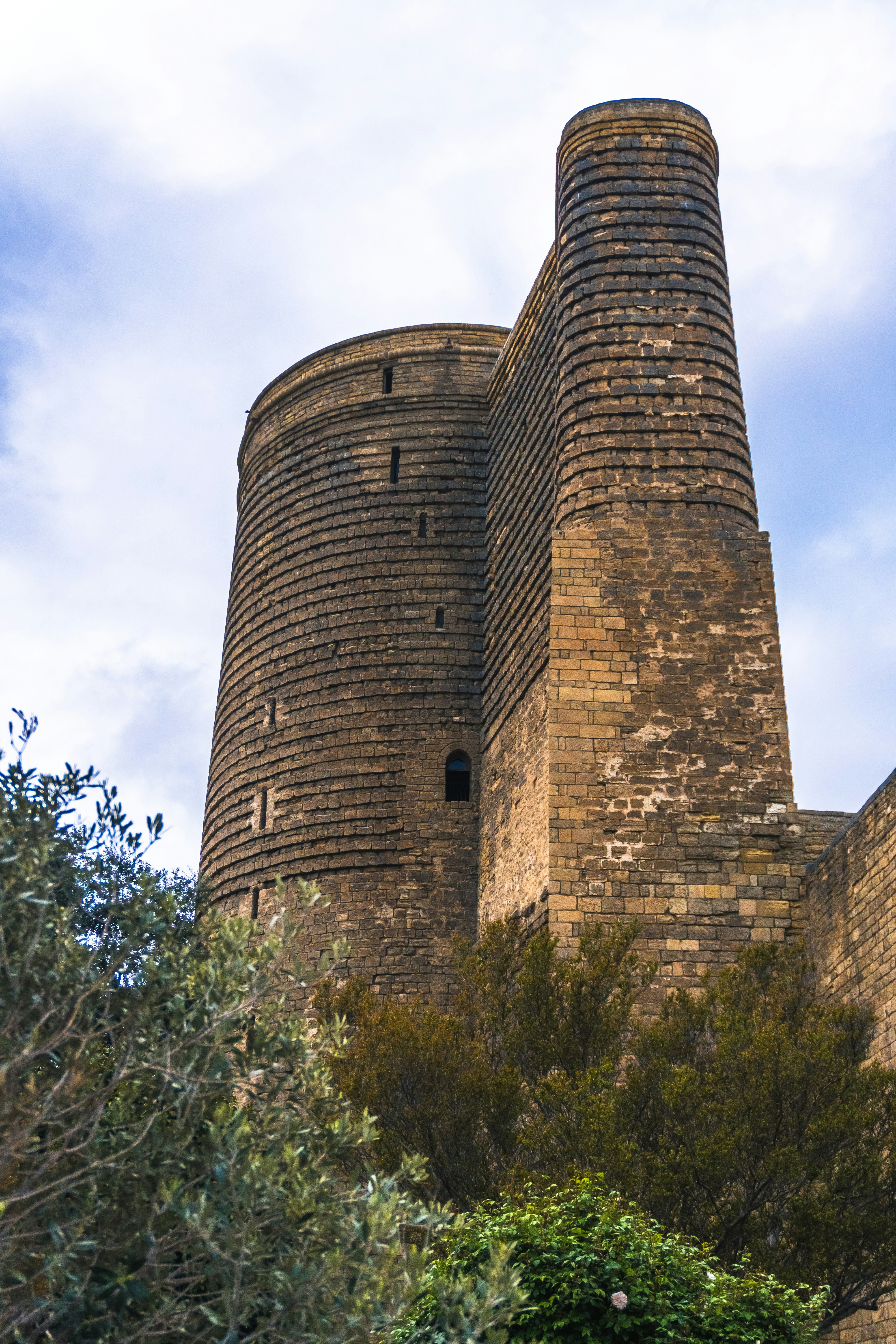 Ancient stone tower against a cloudy sky