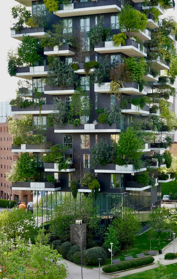 Modern building with lush greenery on balconies