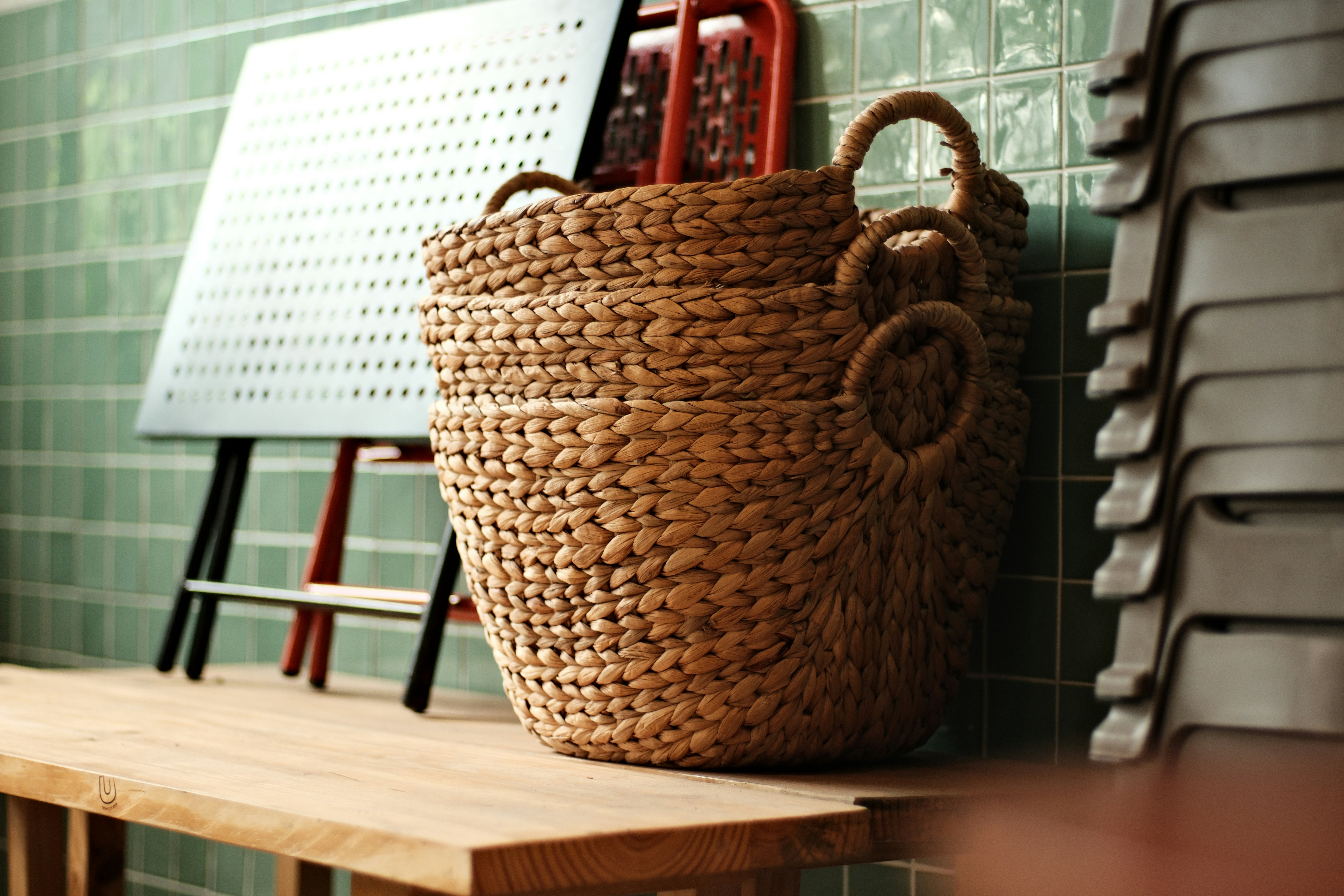 Woven baskets stacked on a wooden bench