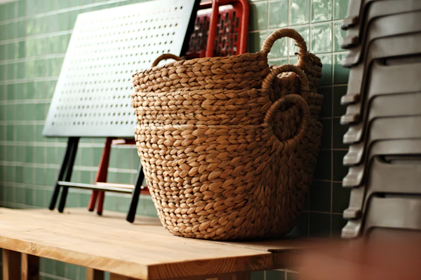Woven baskets stacked on a wooden bench