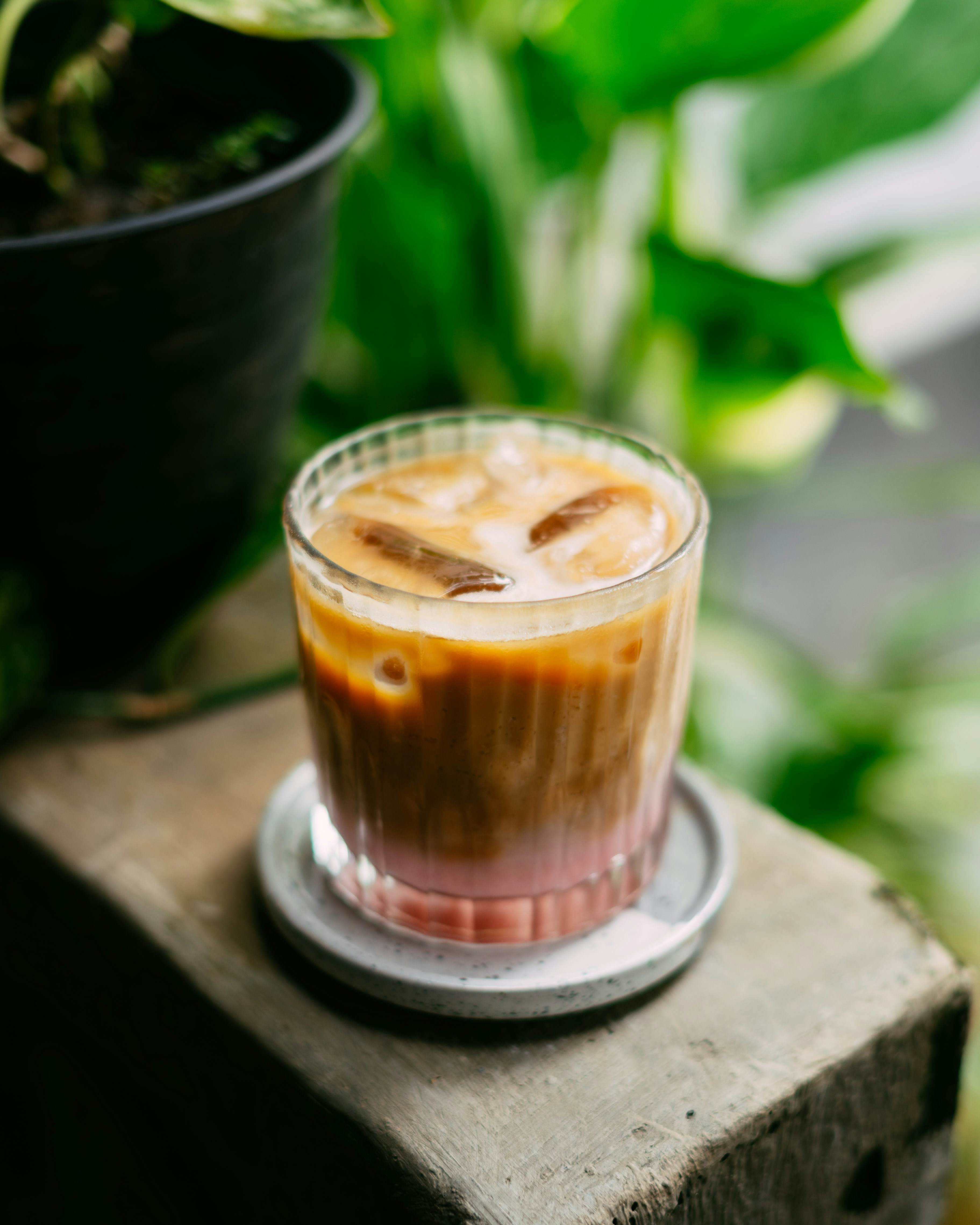 Iced coffee with milk and ice in a glass