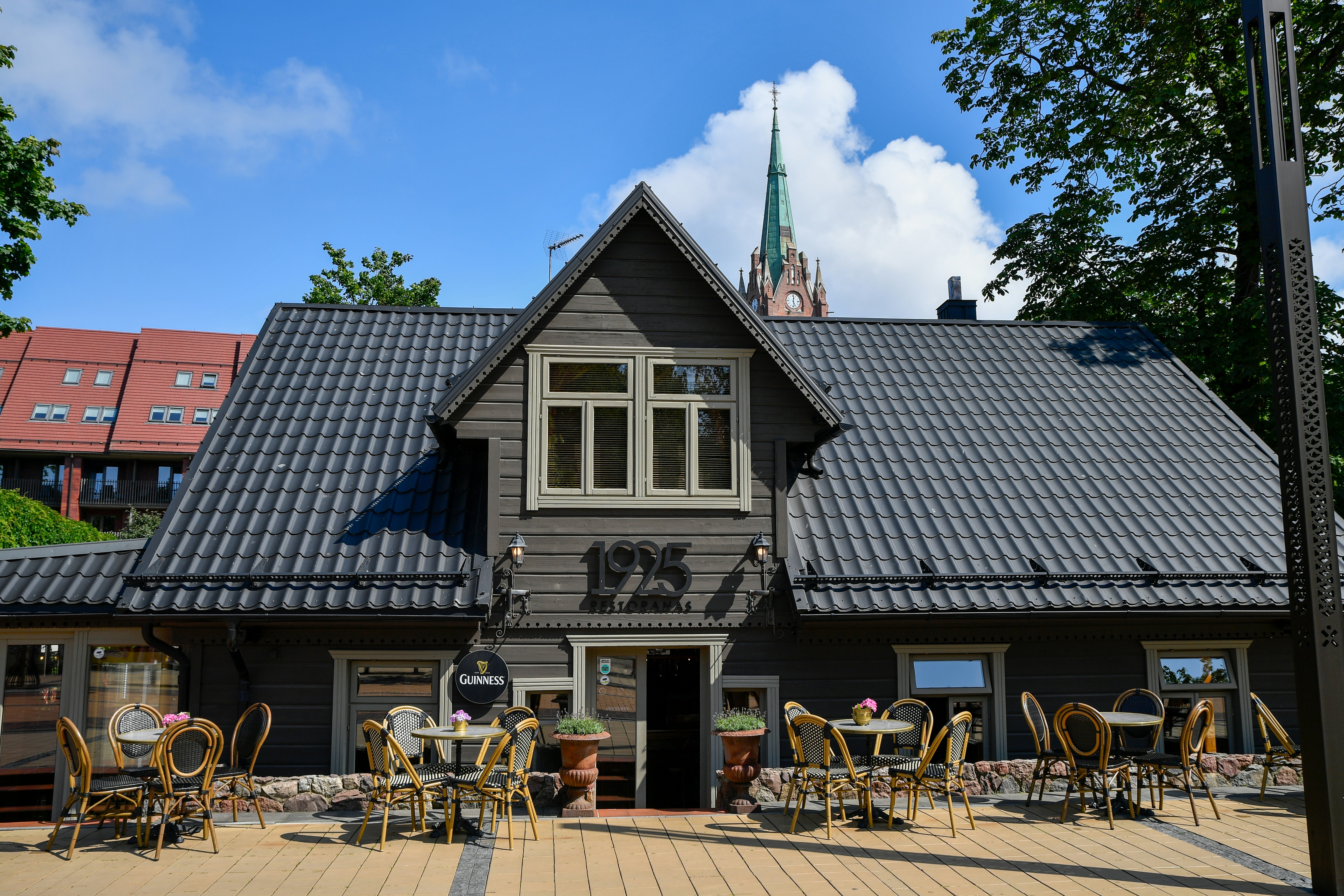 A rustic wooden building with outdoor seating