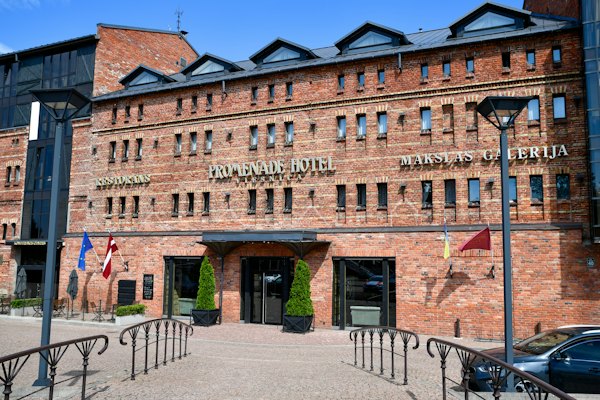 Brick hotel building with flags and entrance — Liepāja, Latvia