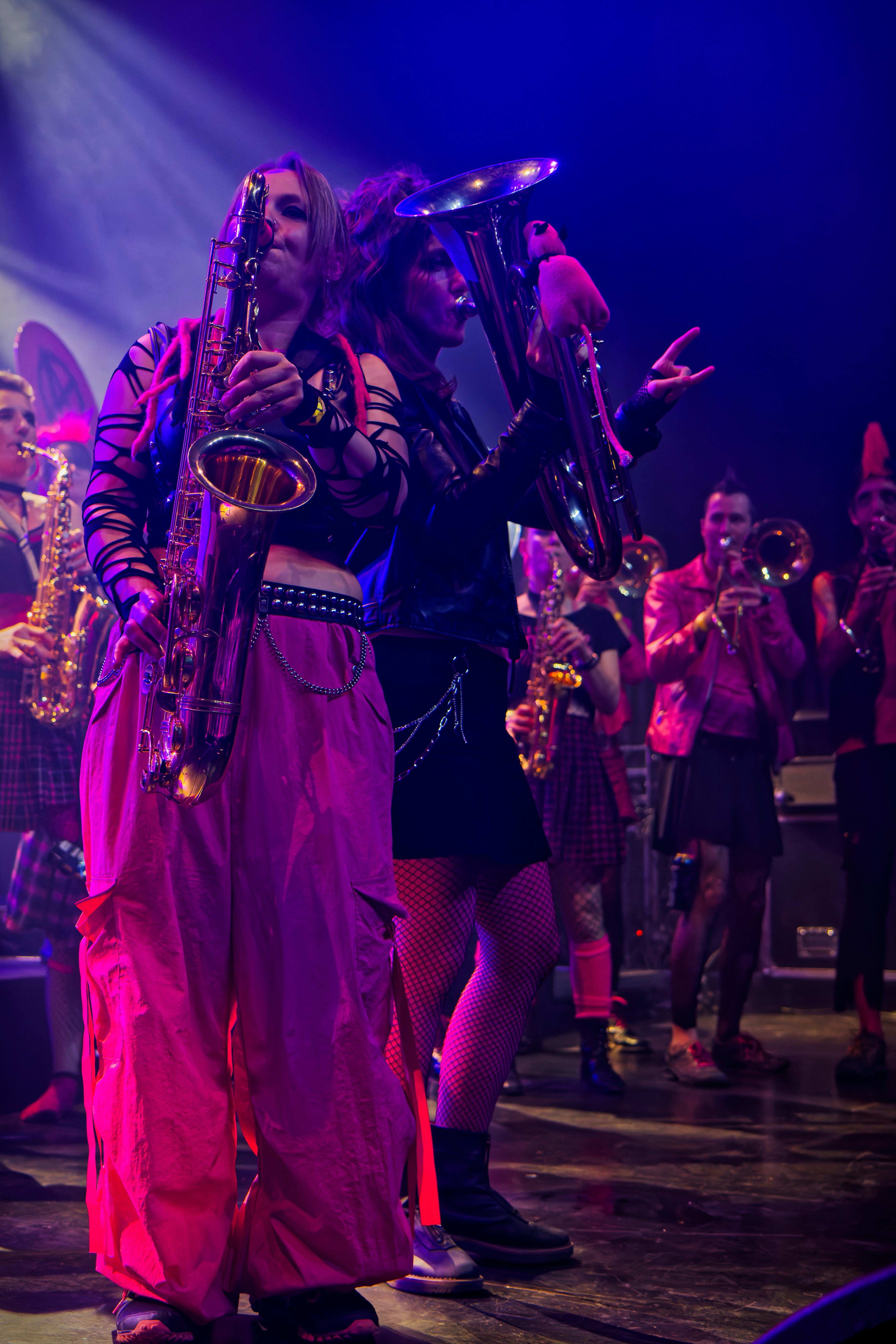 Musicians playing brass instruments on stage