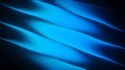 Abstract blue light streaks on a dark background