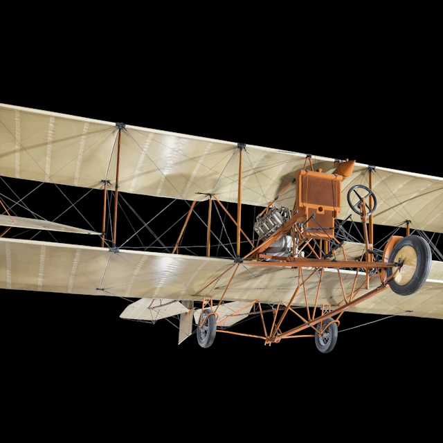 A vintage open-cockpit Curtiss biplane photographed against a black background