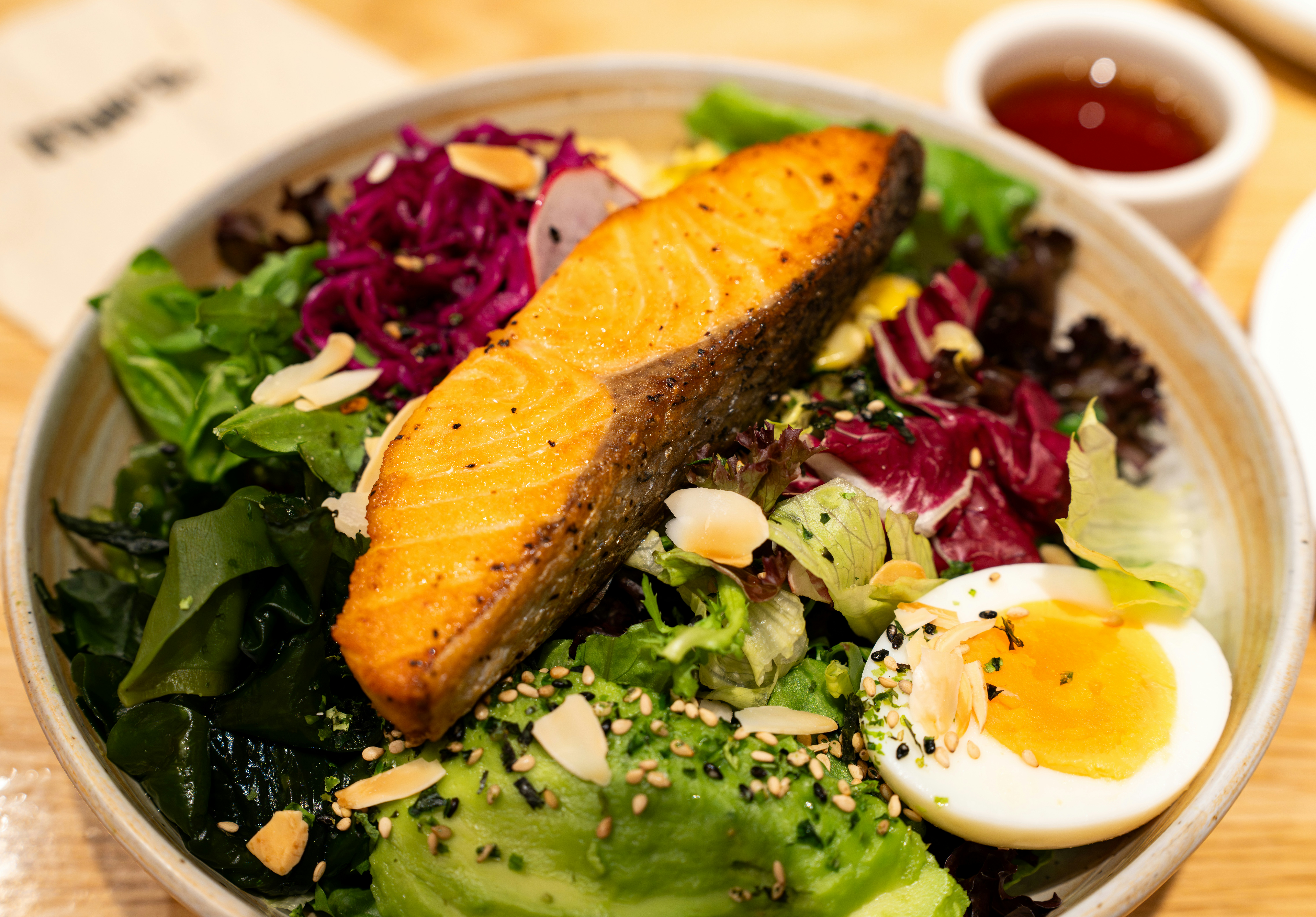 Salmon and avocado salad with a soft-boiled egg