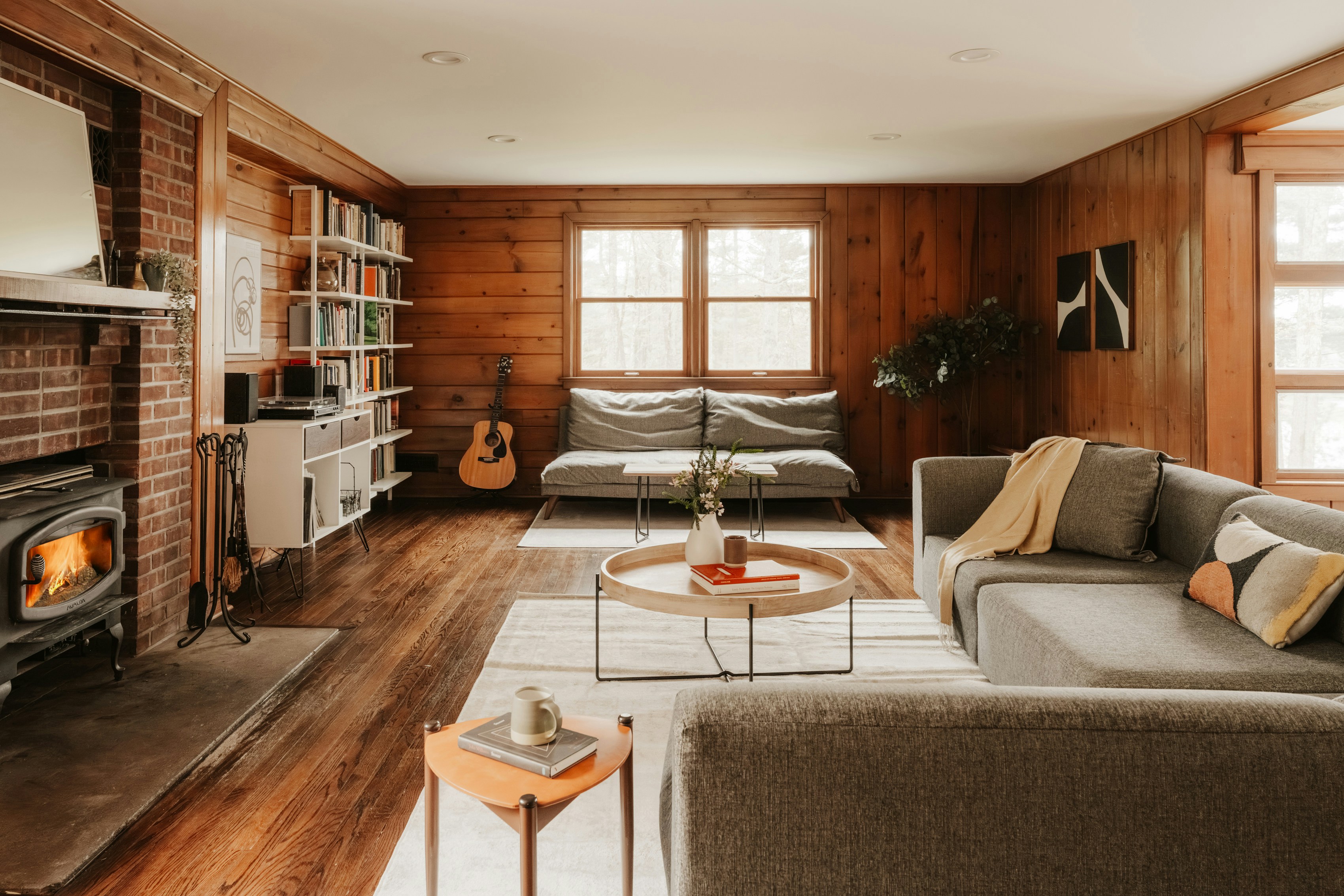 Cozy living room with fireplace and sectional sofa.