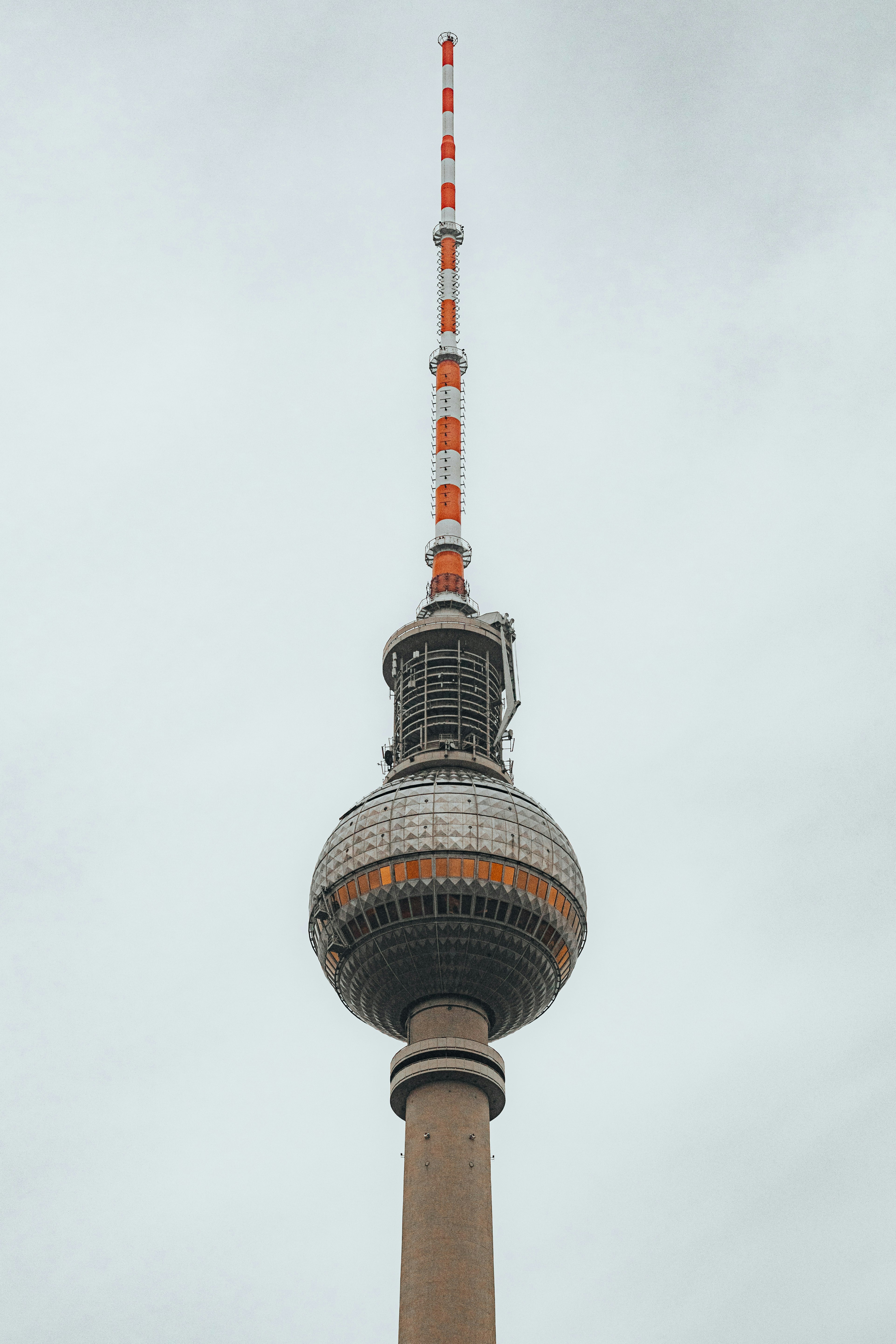 A tall tower with a spherical base and antenna