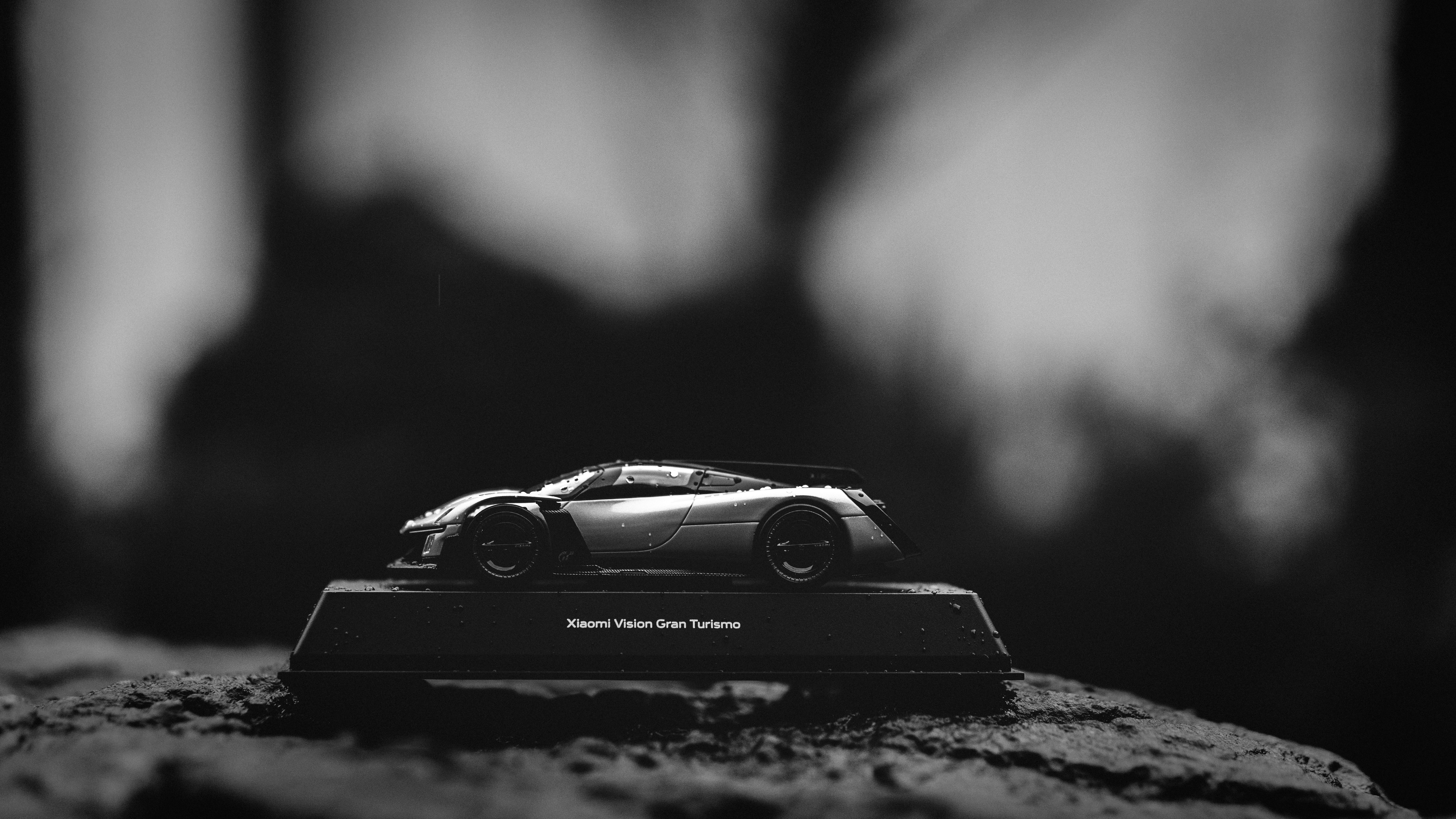 A miniature sports car on display outdoors