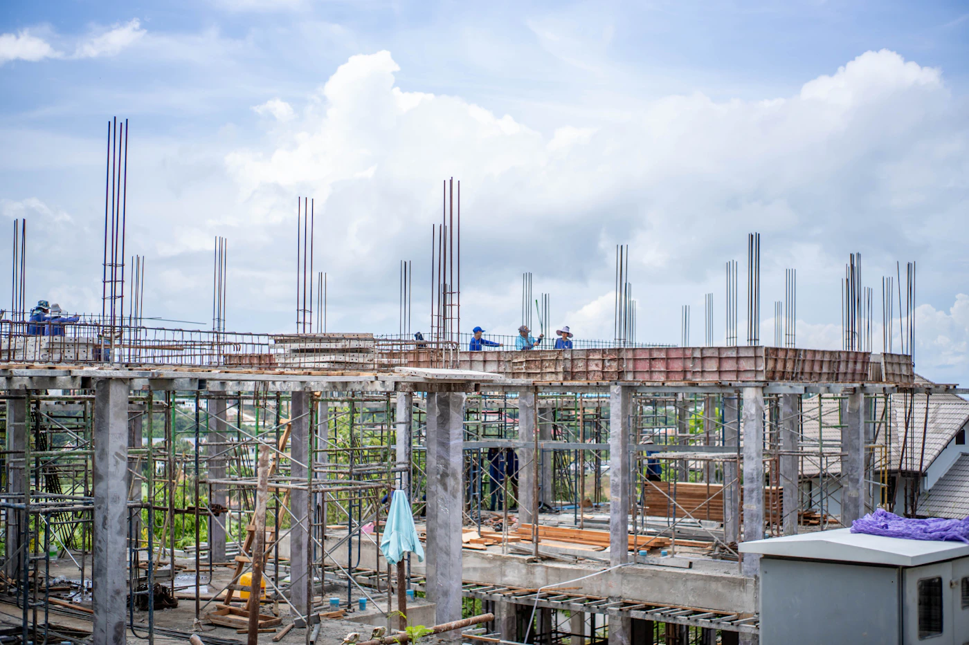Construction professionals working on a building structure