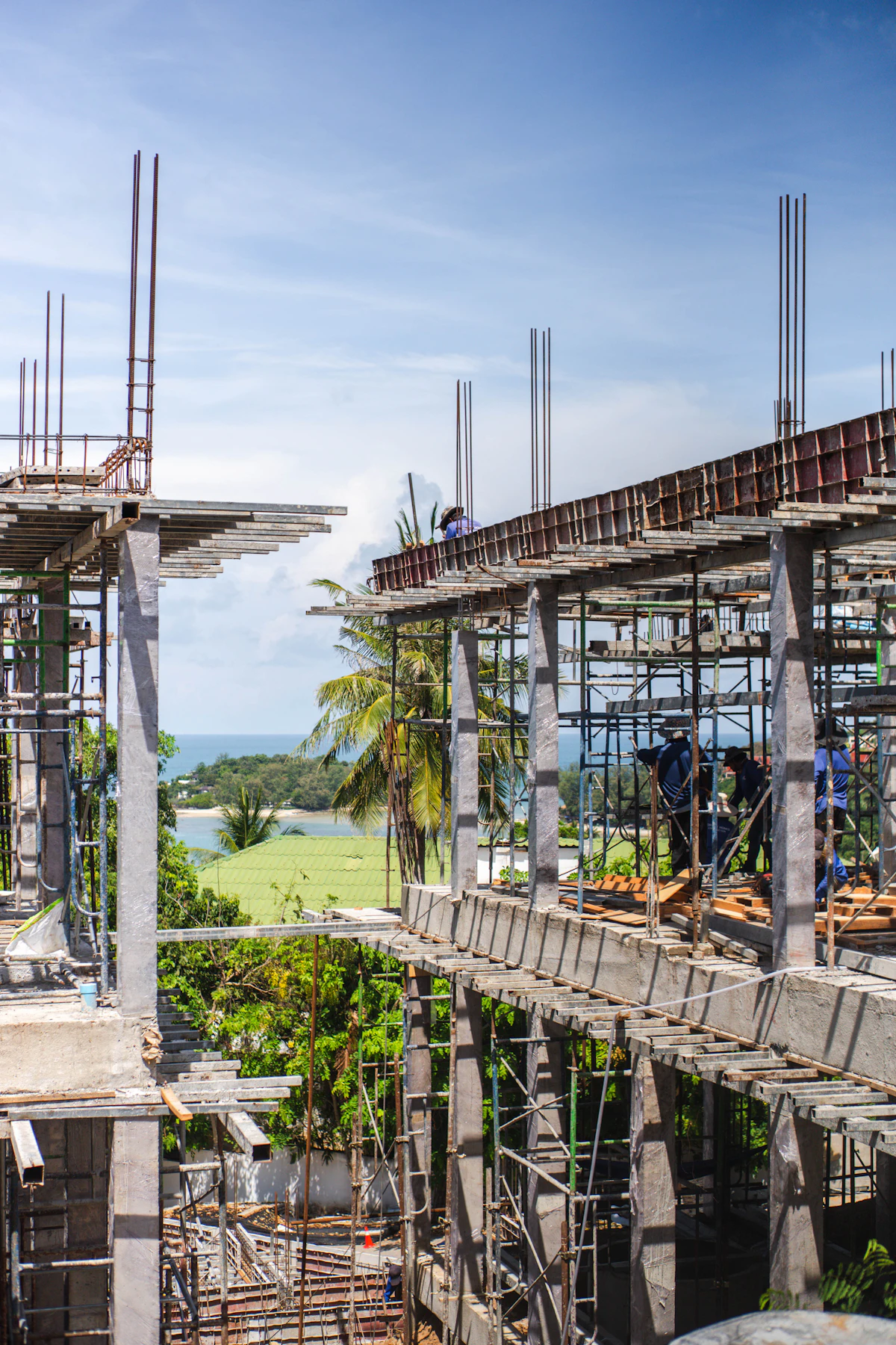 Construction site with workers building a concrete structure