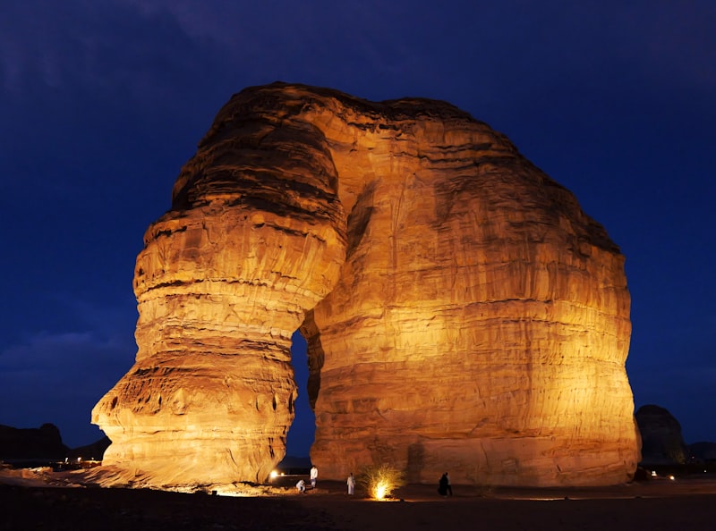 Elephant Rock illuminated at night in AlUla