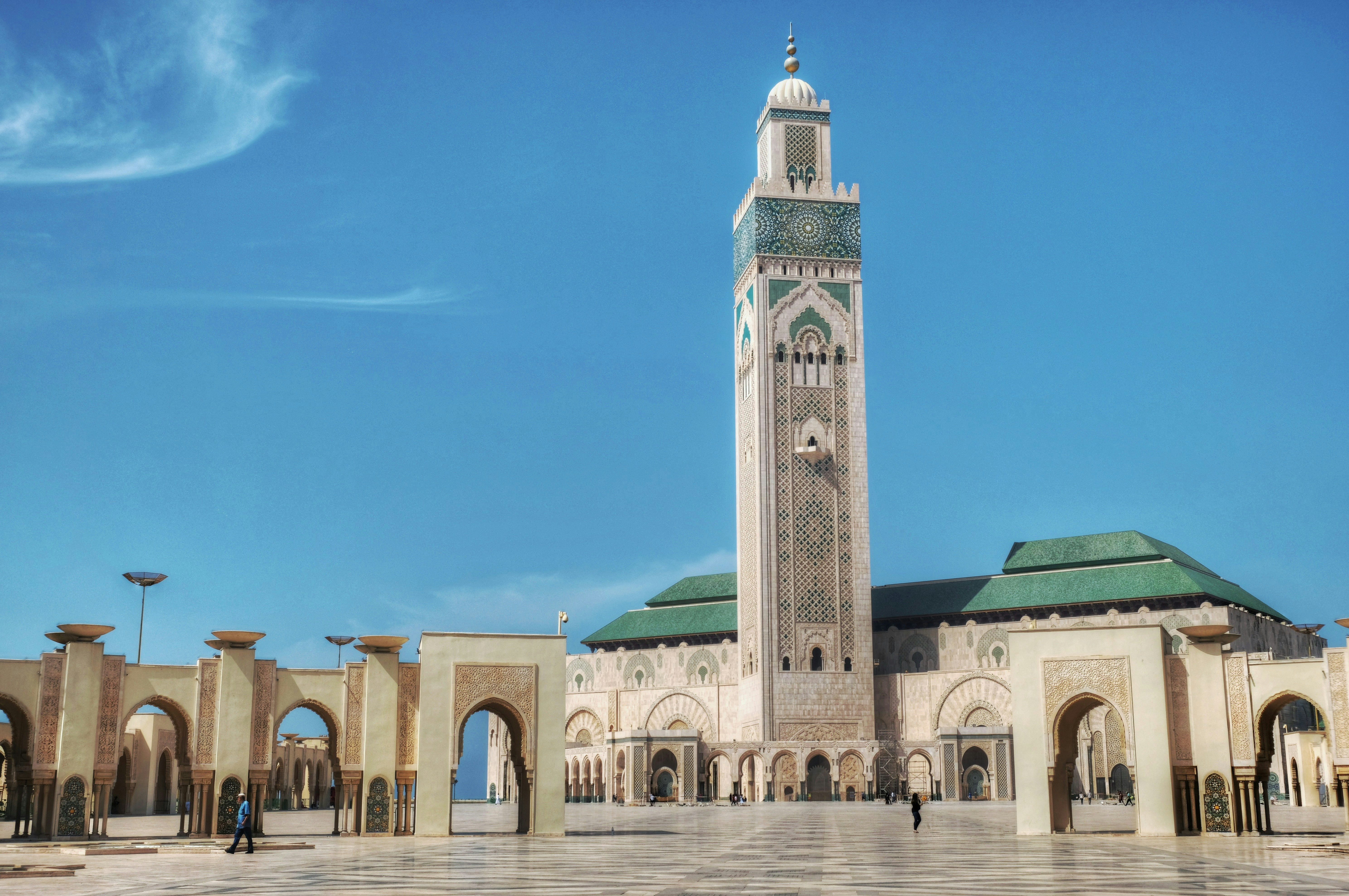 Hassan ii mosque in casablanca, morocco under blue sky.