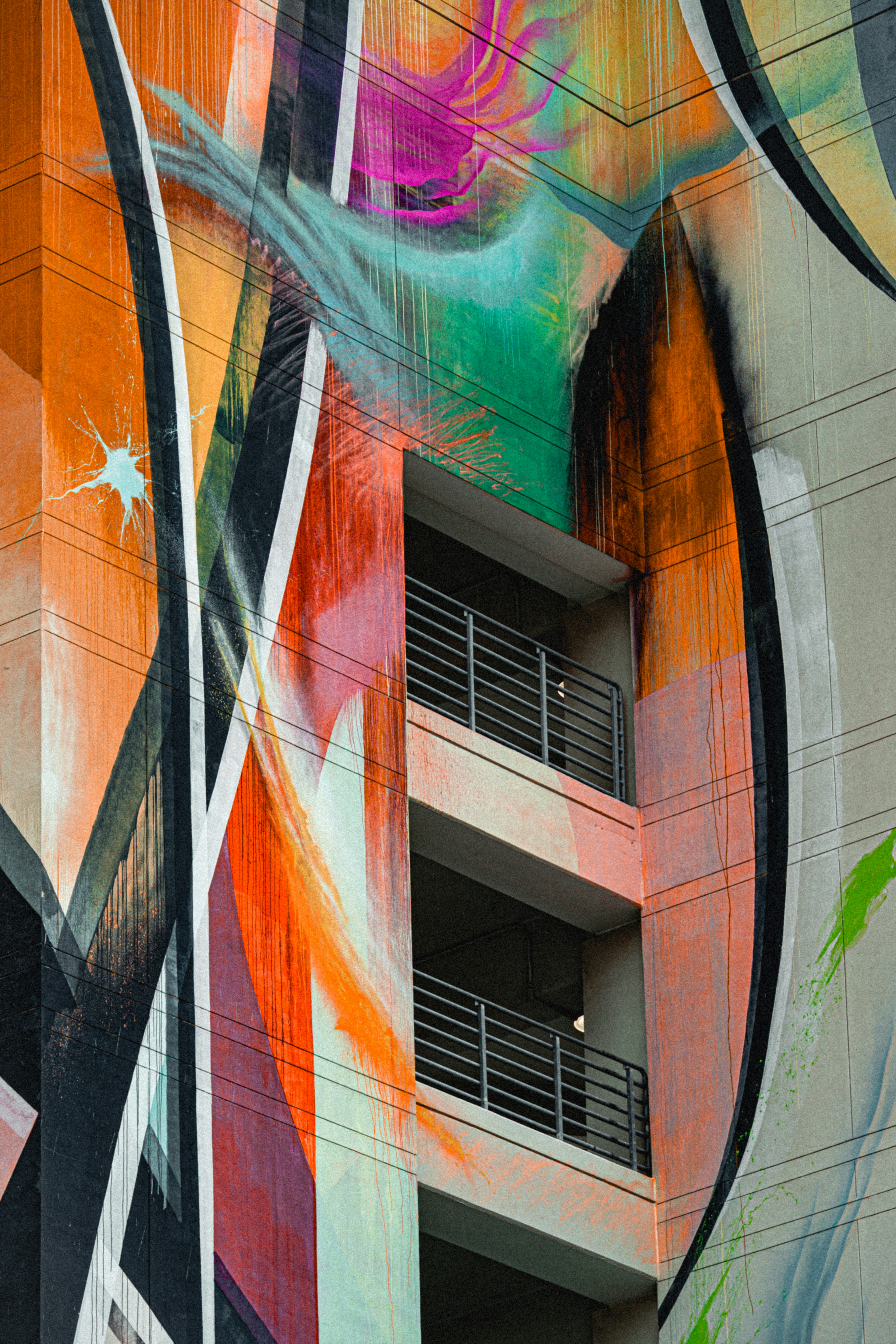 Colorful abstract graffiti art on a building facade.