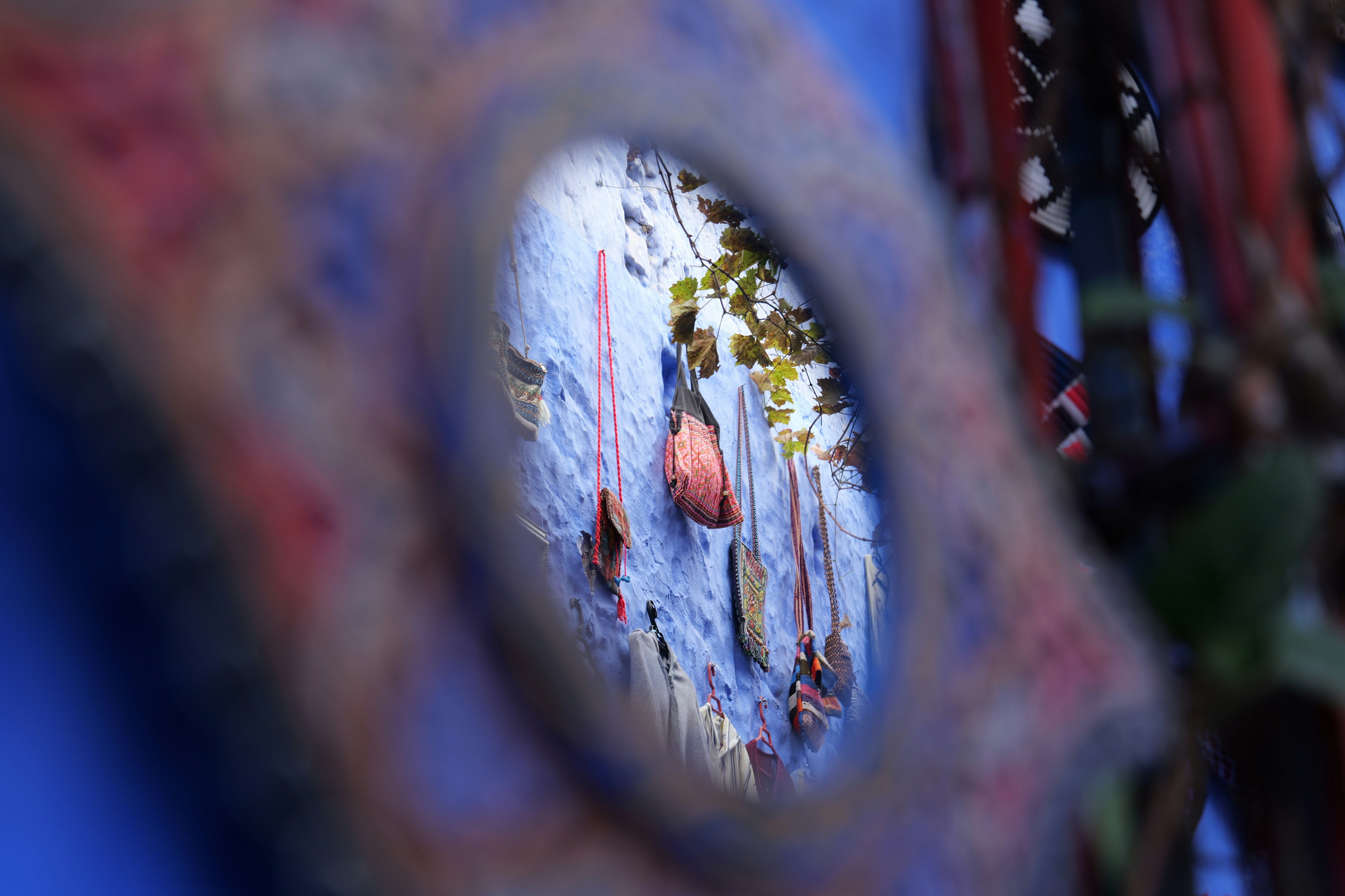 Reflection of hanging objects on a blue wall