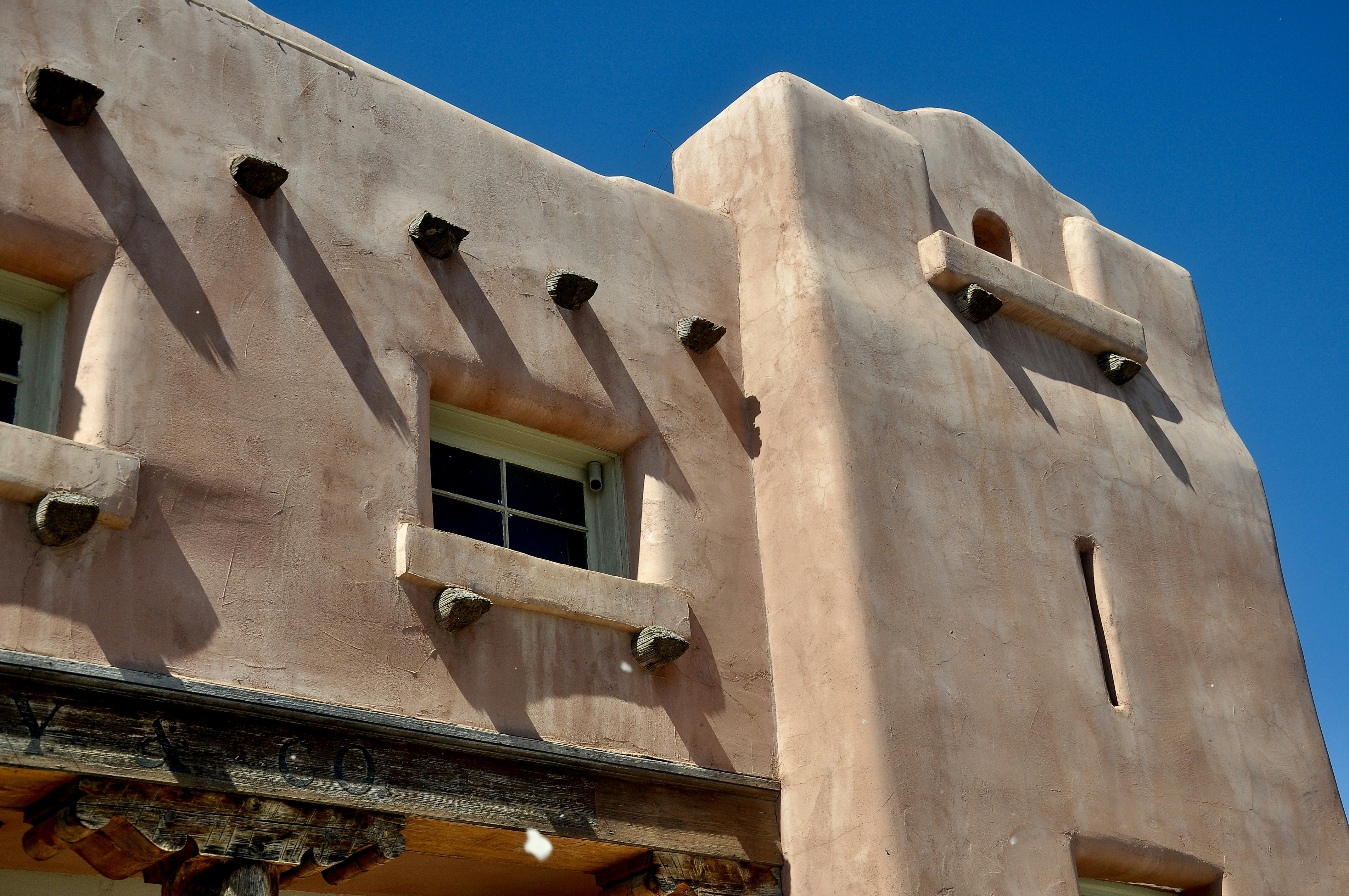 Southwestern adobe building with clear blue sky