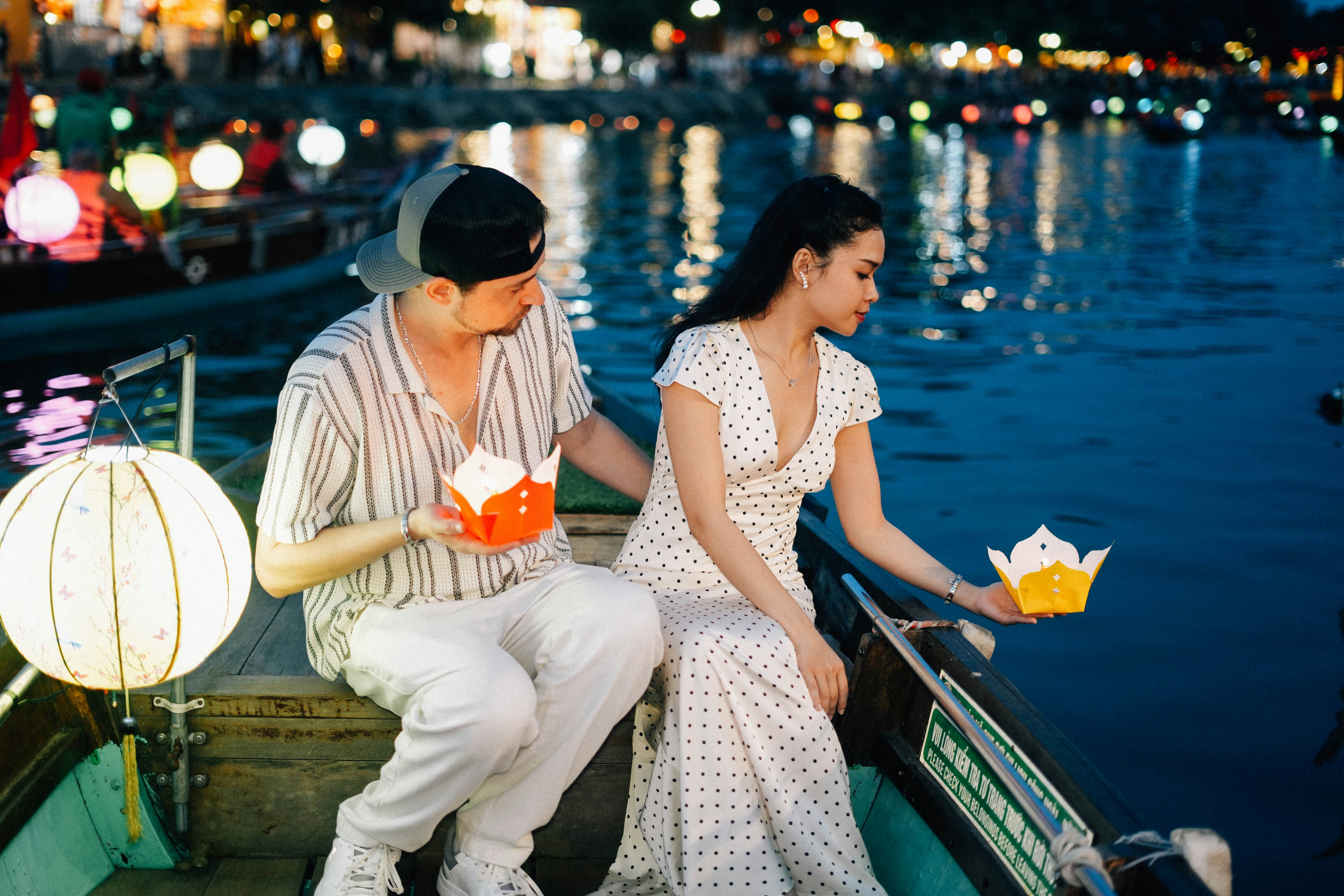 Couple floating lanterns on a boat at night. photo – Free Travel Image ...