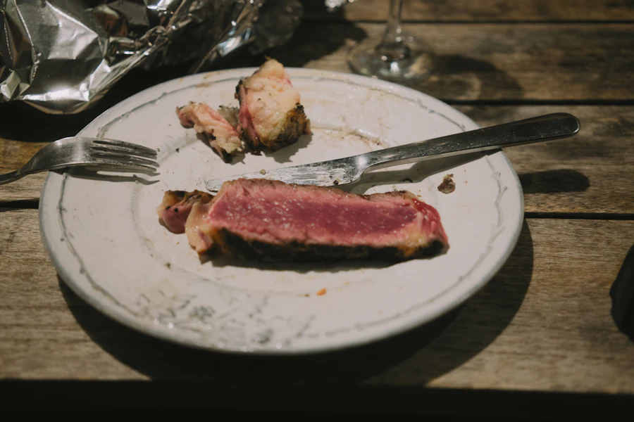A rare steak being plated