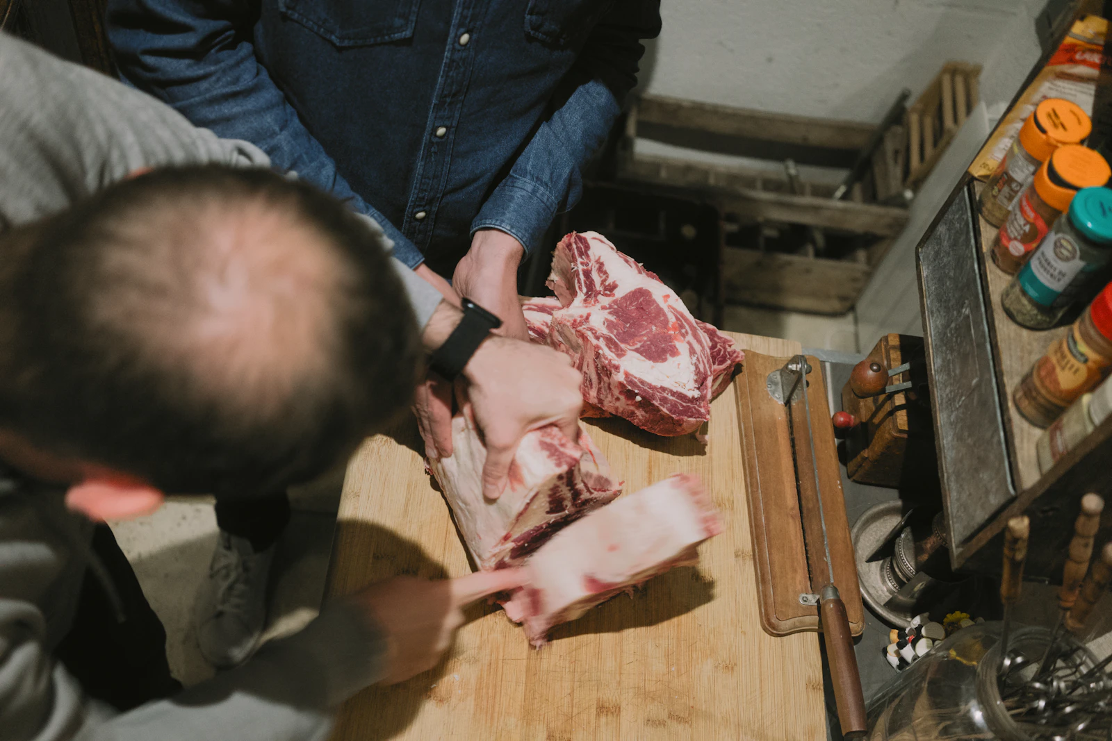 Professional butcher preparing fresh meat cuts for a retail or wholesale butcher job