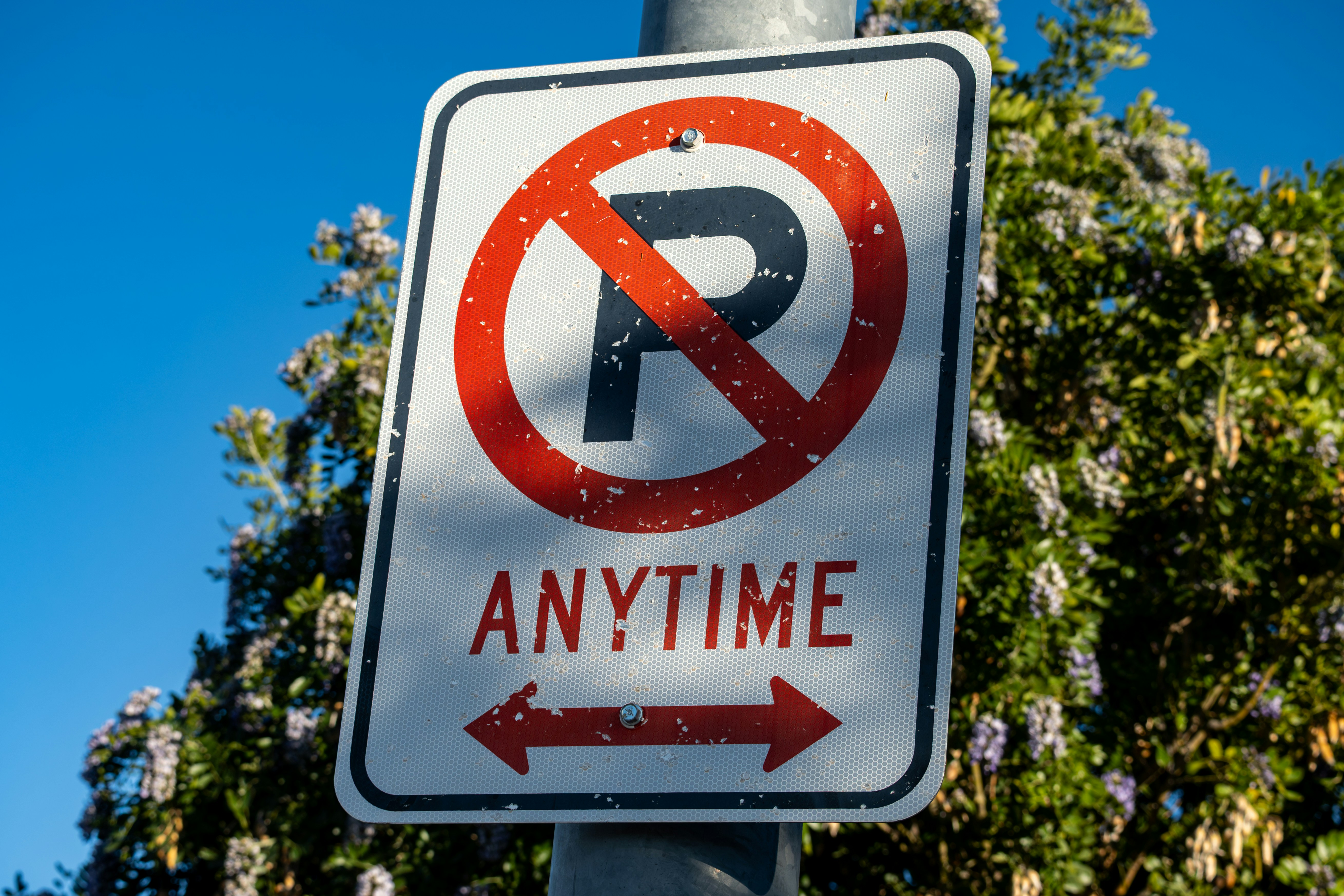 No parking anytime sign with arrows