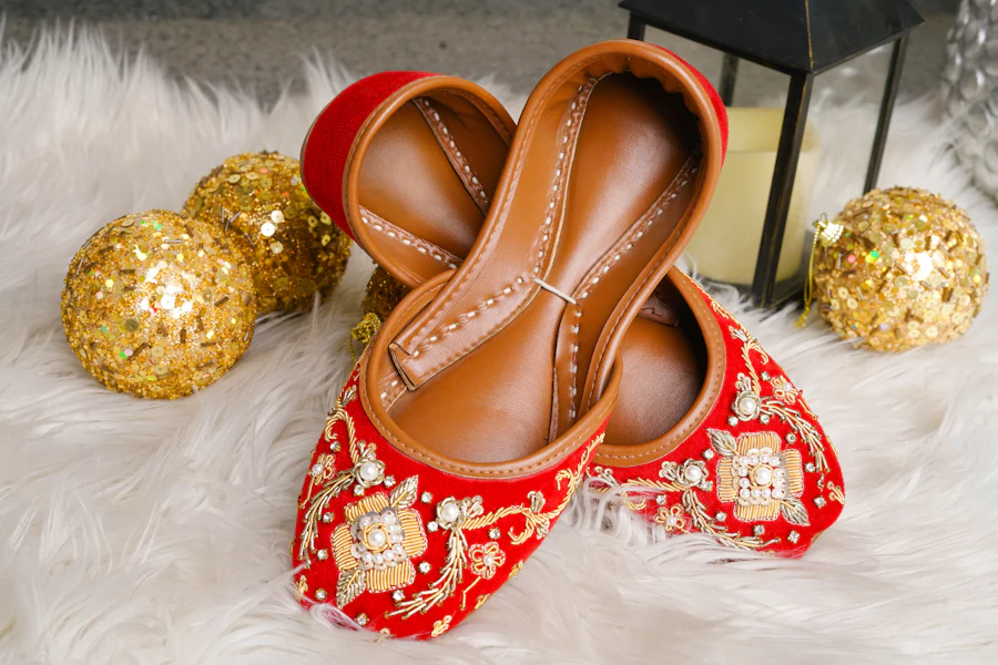 Women's red embroidered Punjabi jutti with gold sequins