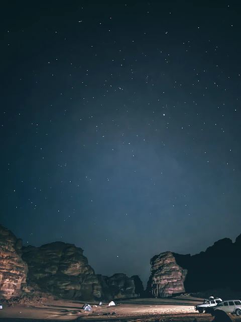 Desert landscape with tents and stars at night djanet algeria