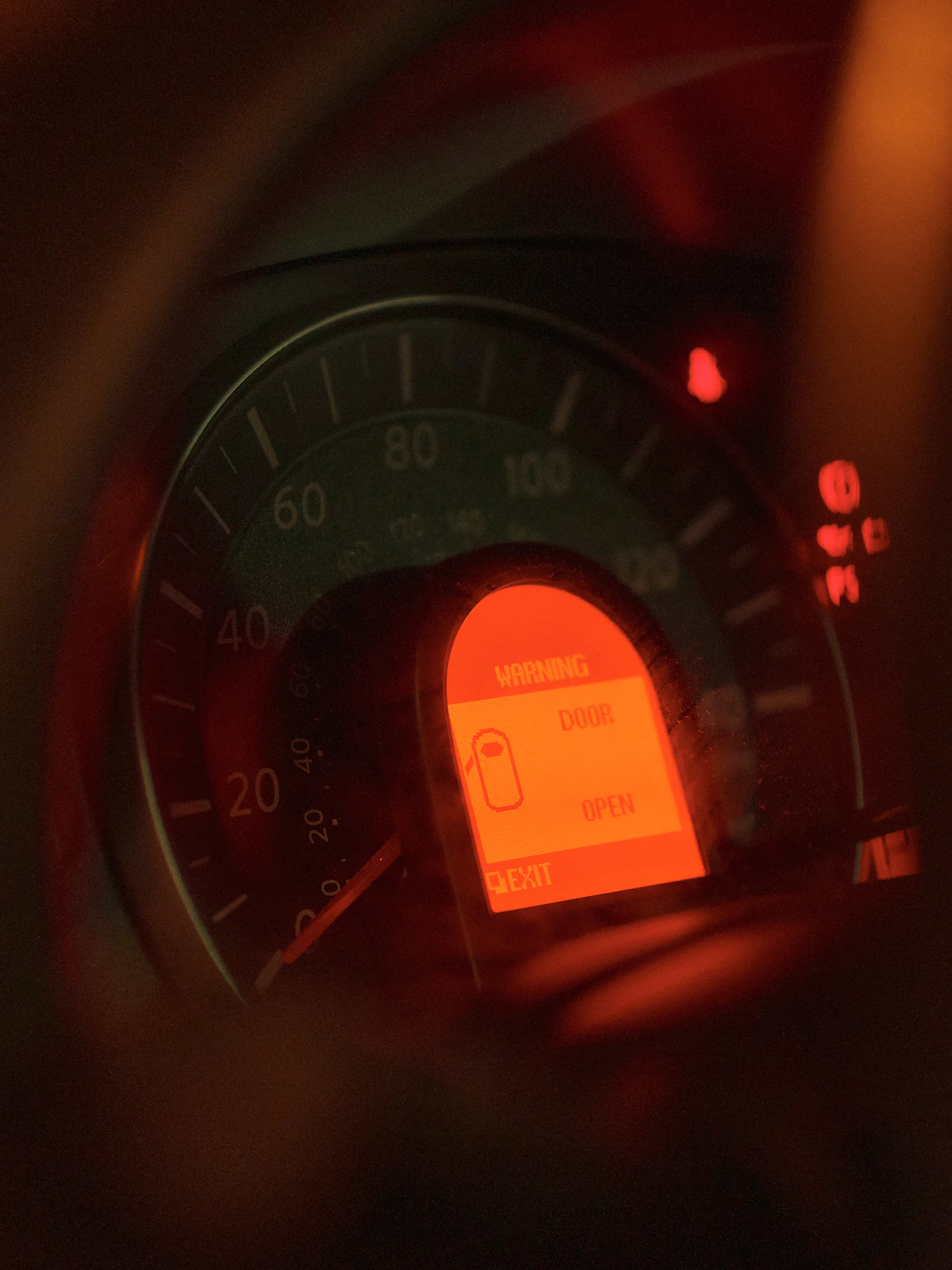 A car dashboard with warning lights illuminated