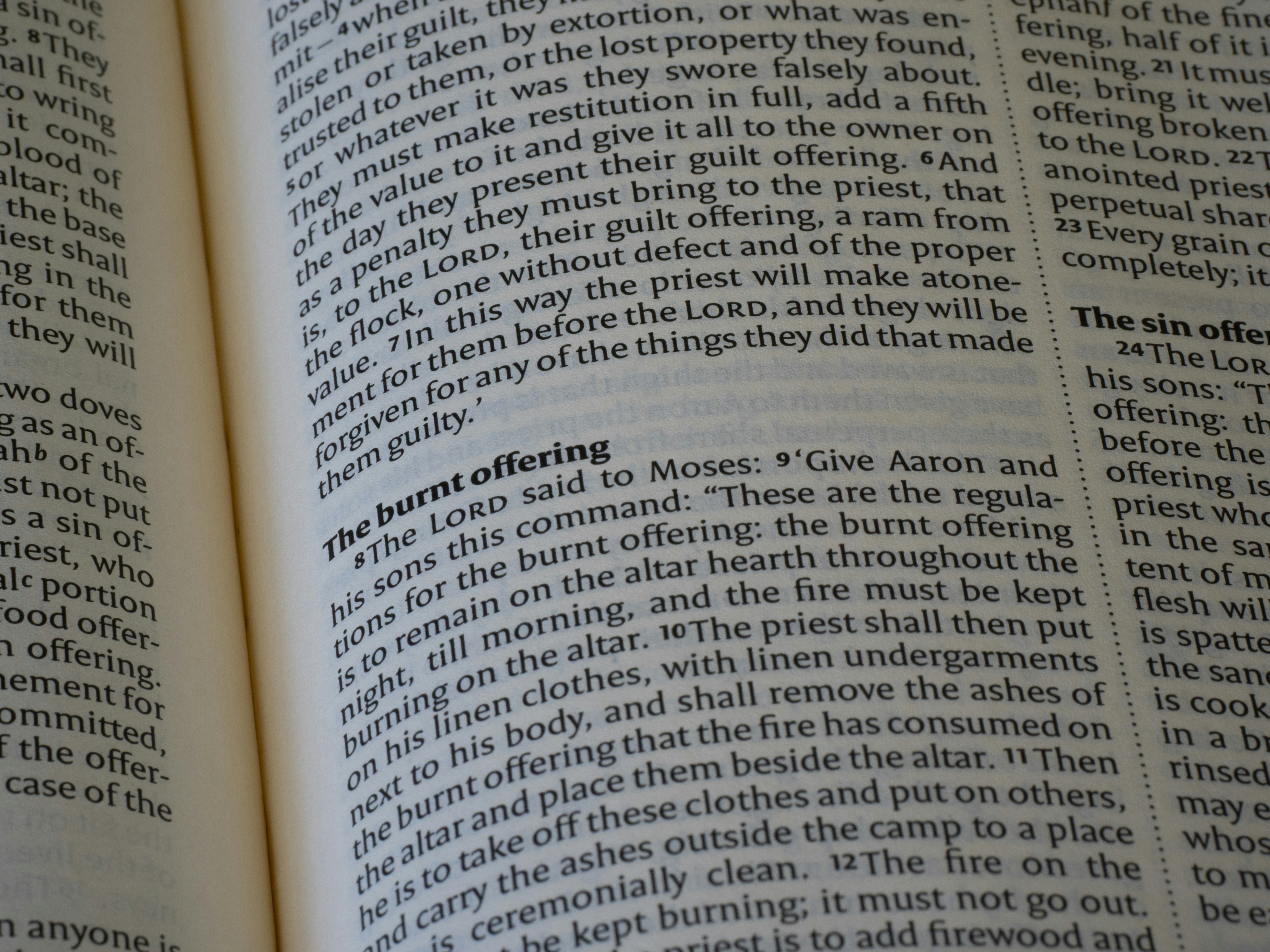 Close-up of an open book with text on pages.