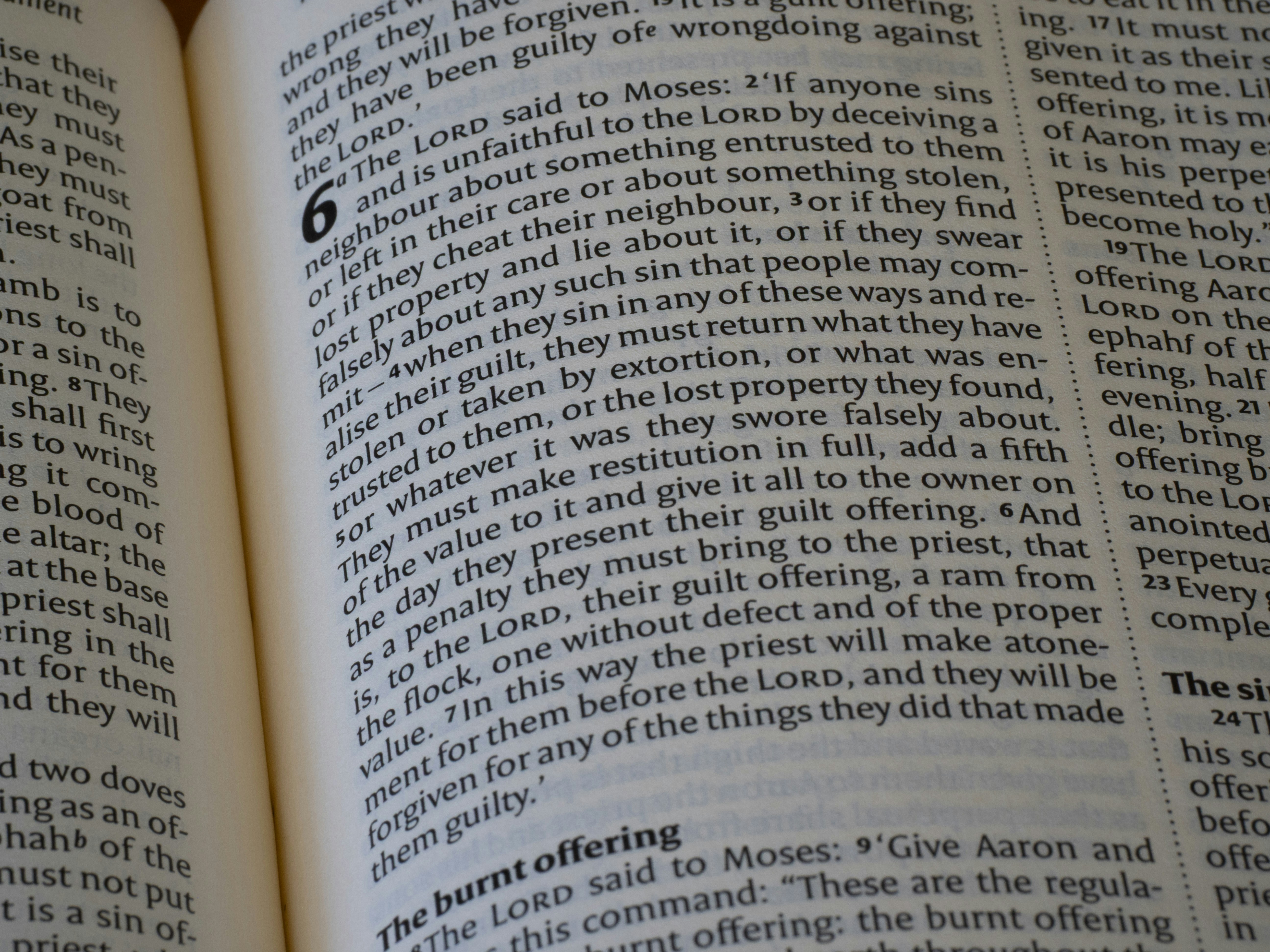 Close-up of an open bible with text visible.