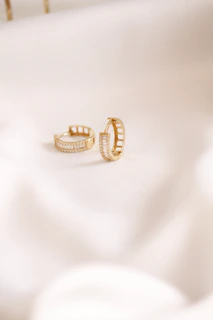 Gold hoop earrings with baguette diamonds