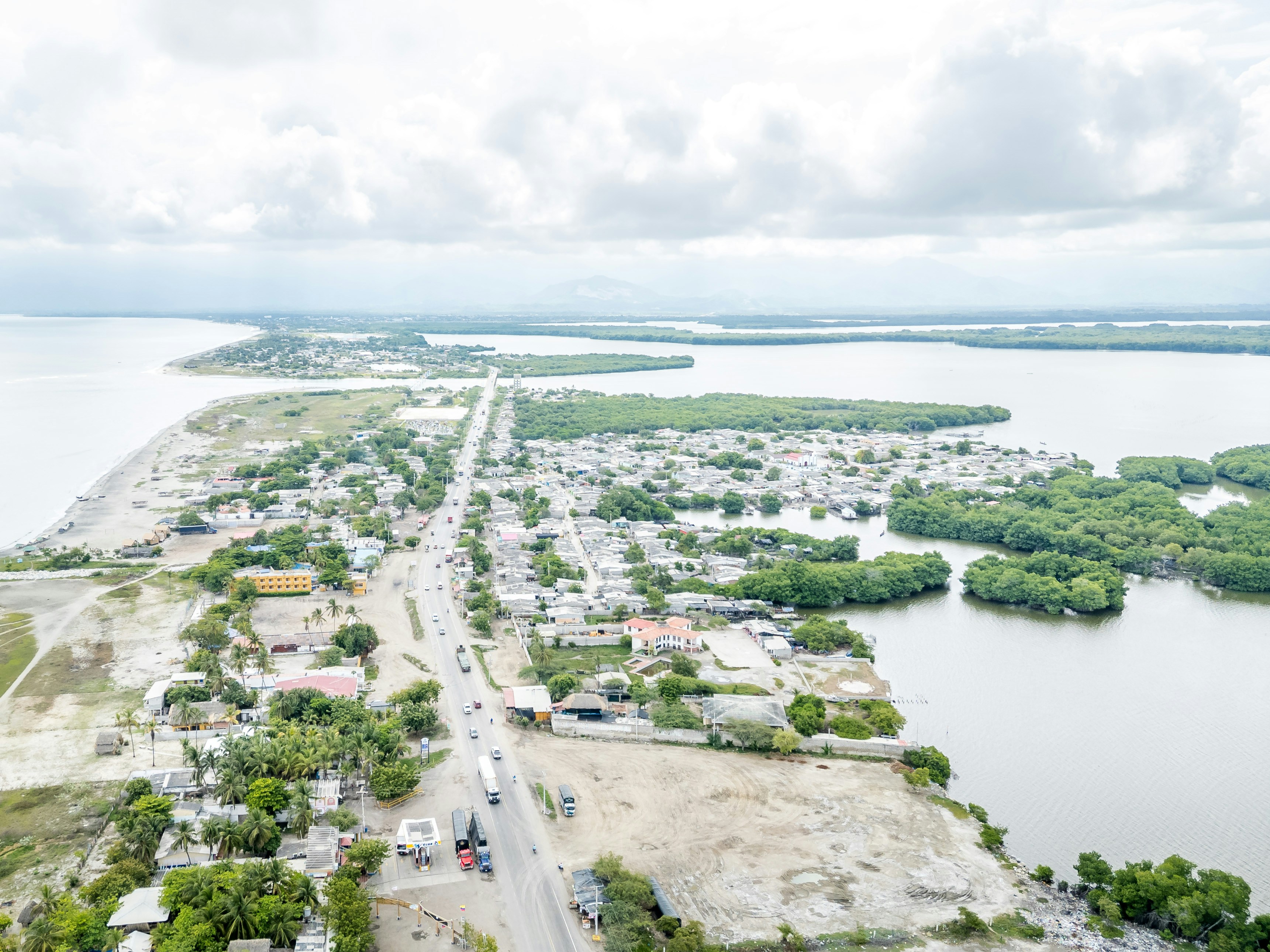 Aerial view of a coastal town with roads and waterways.