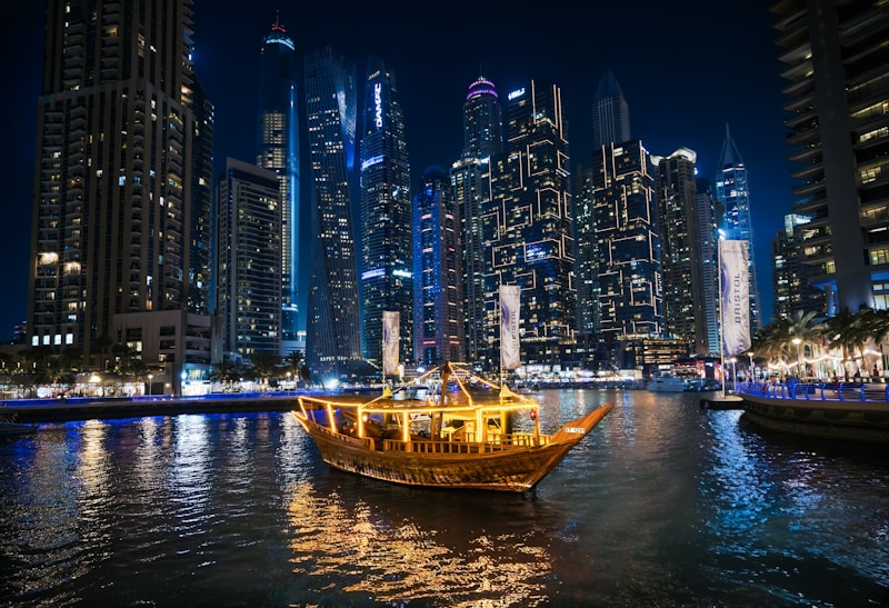 Illuminated traditional dhow dinner cruise boat at Dubai Marina