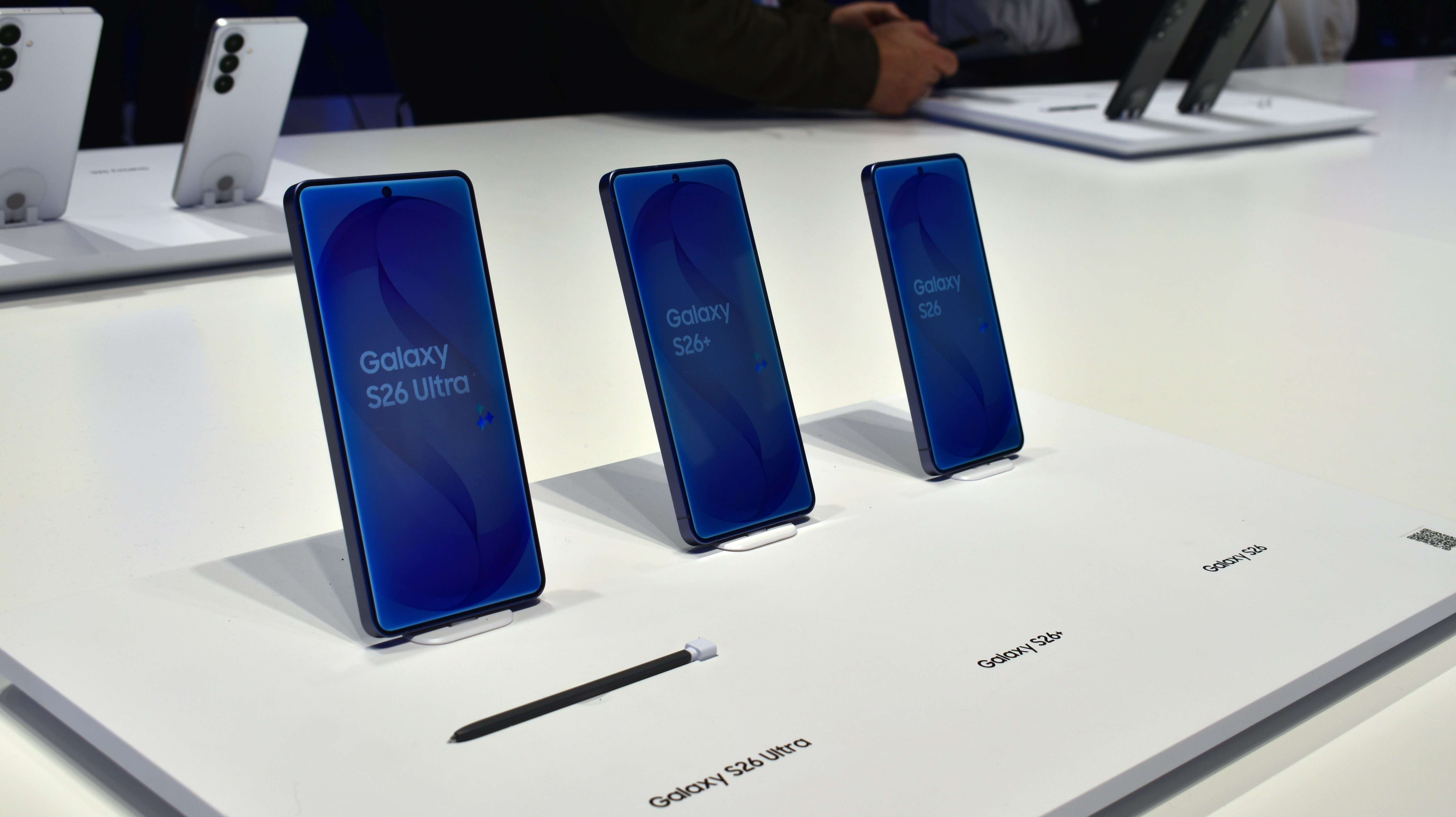 Three samsung galaxy smartphones displayed on a white surface.
