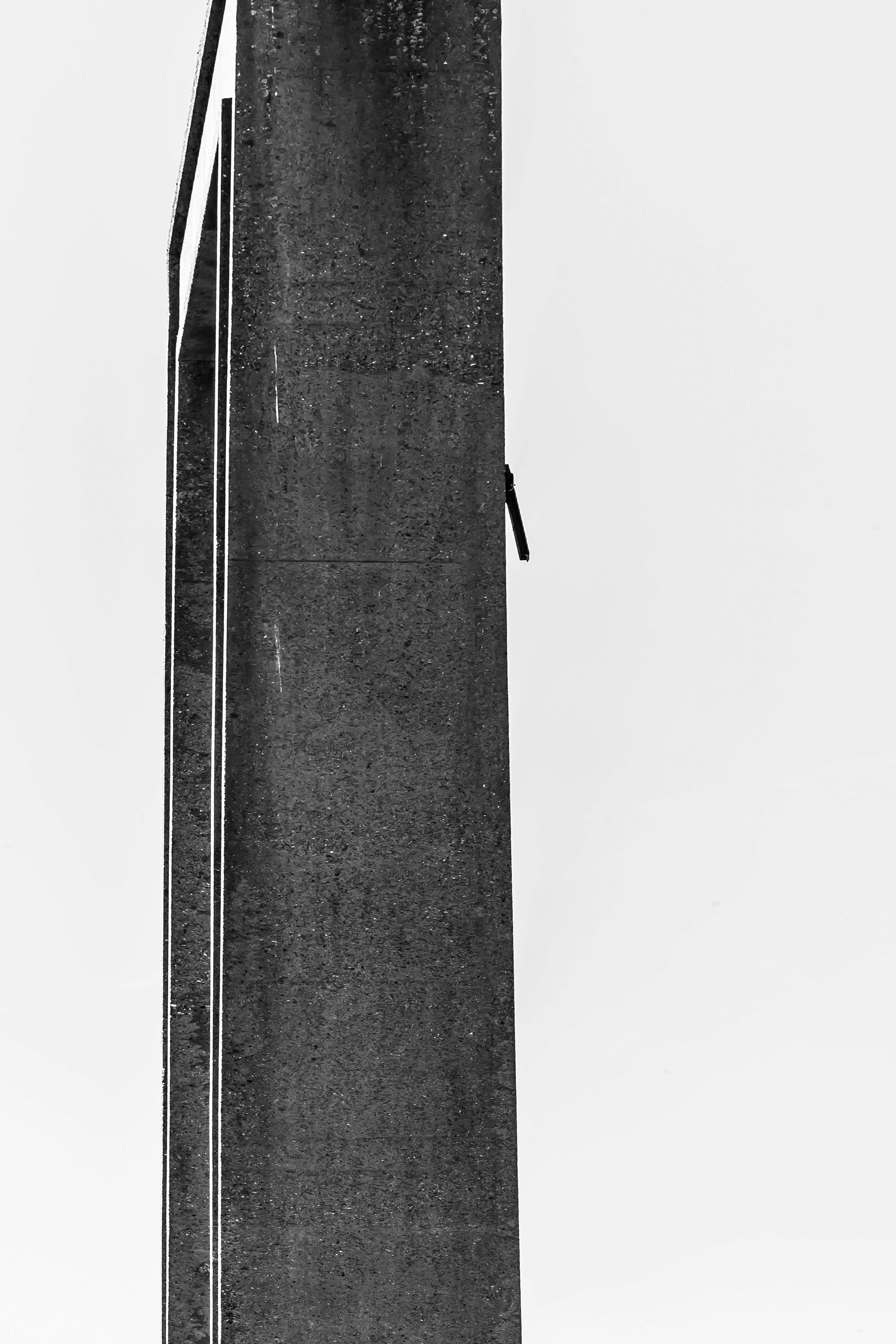 Abstract architectural detail with textured dark surface