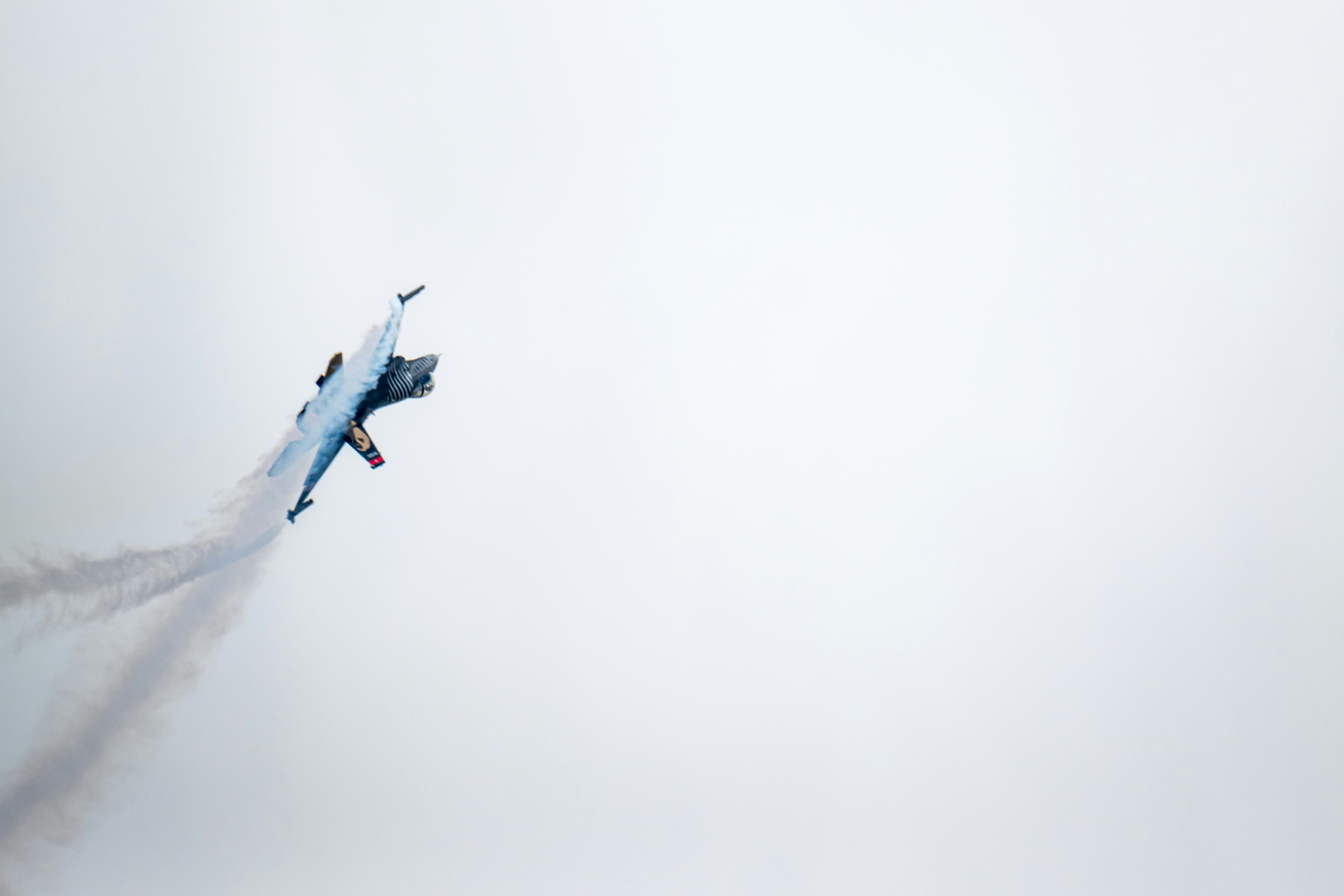 Turkish Air Force SoloTürk F-16 Fighter Jet Performing High-Speed Aerobatic Demo Flight with Smoke Trail Over Turkey Sky
