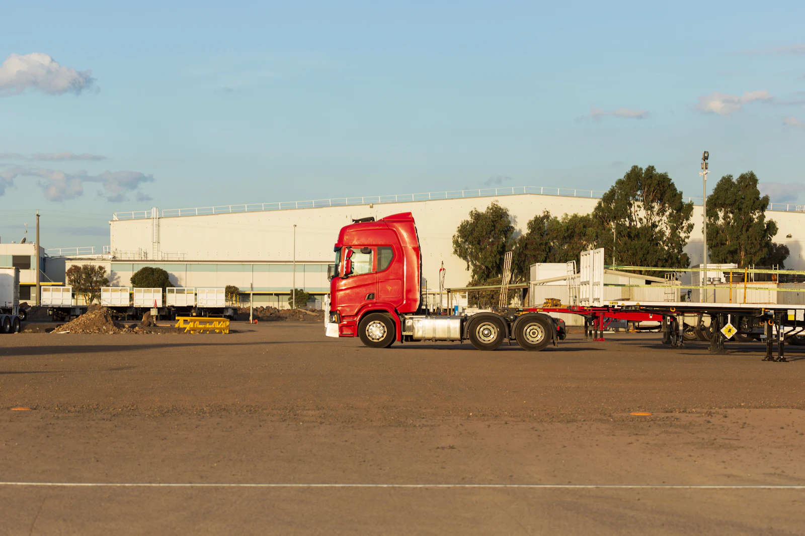 Large container truck parked at an industrial yard