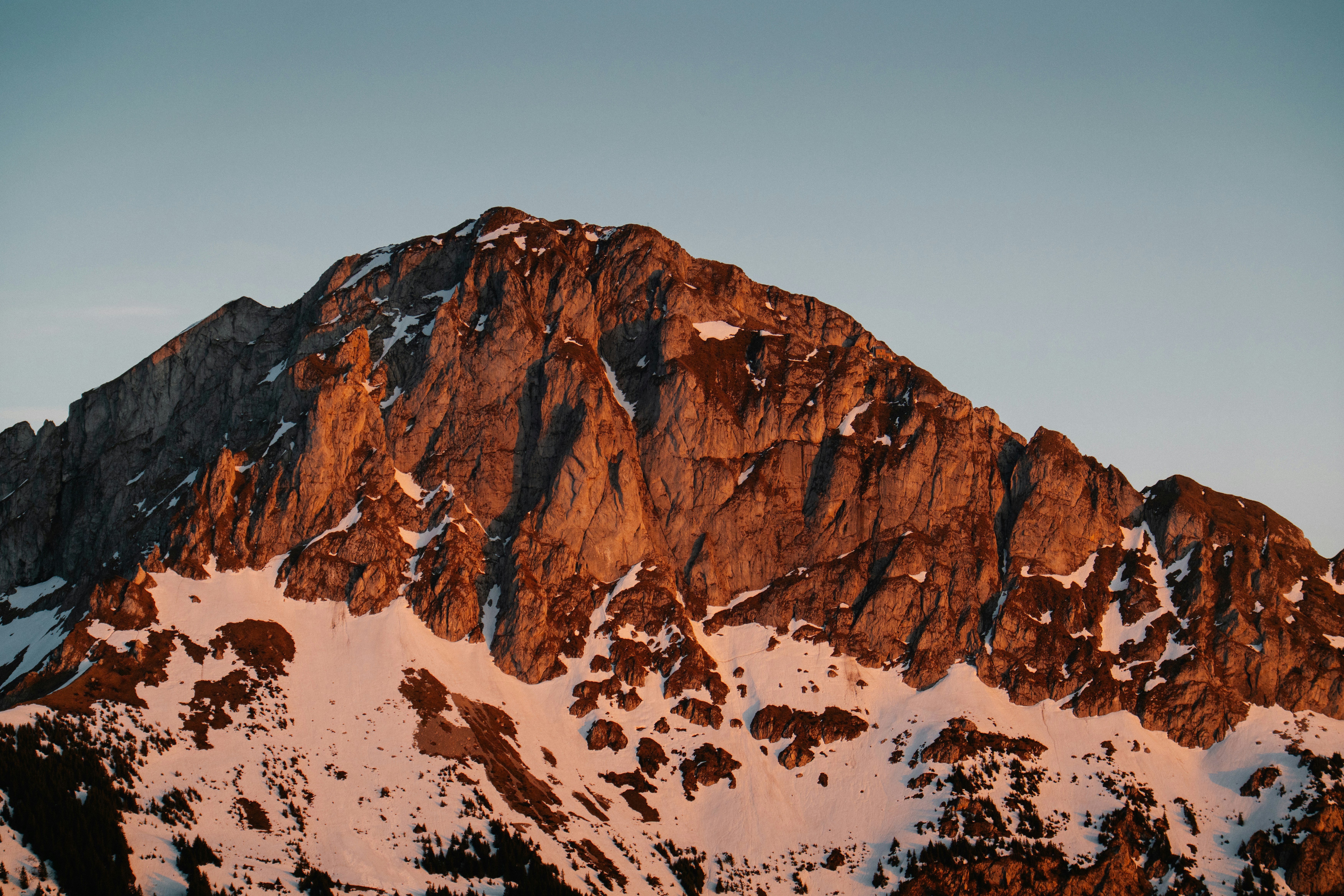 Majestic mountain peak bathed in warm sunset light