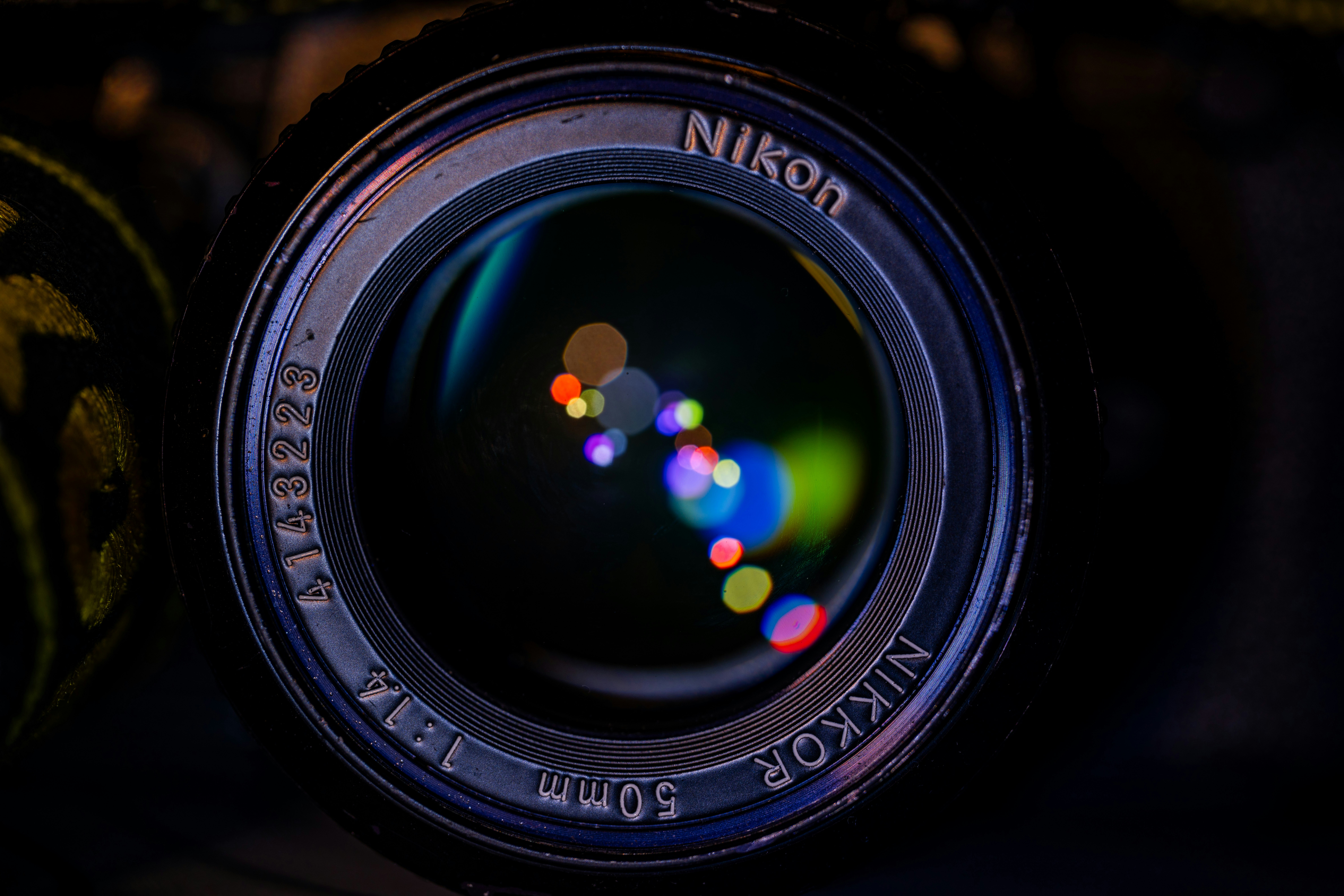 Close-up of a nikon nikkor 50mm camera lens.