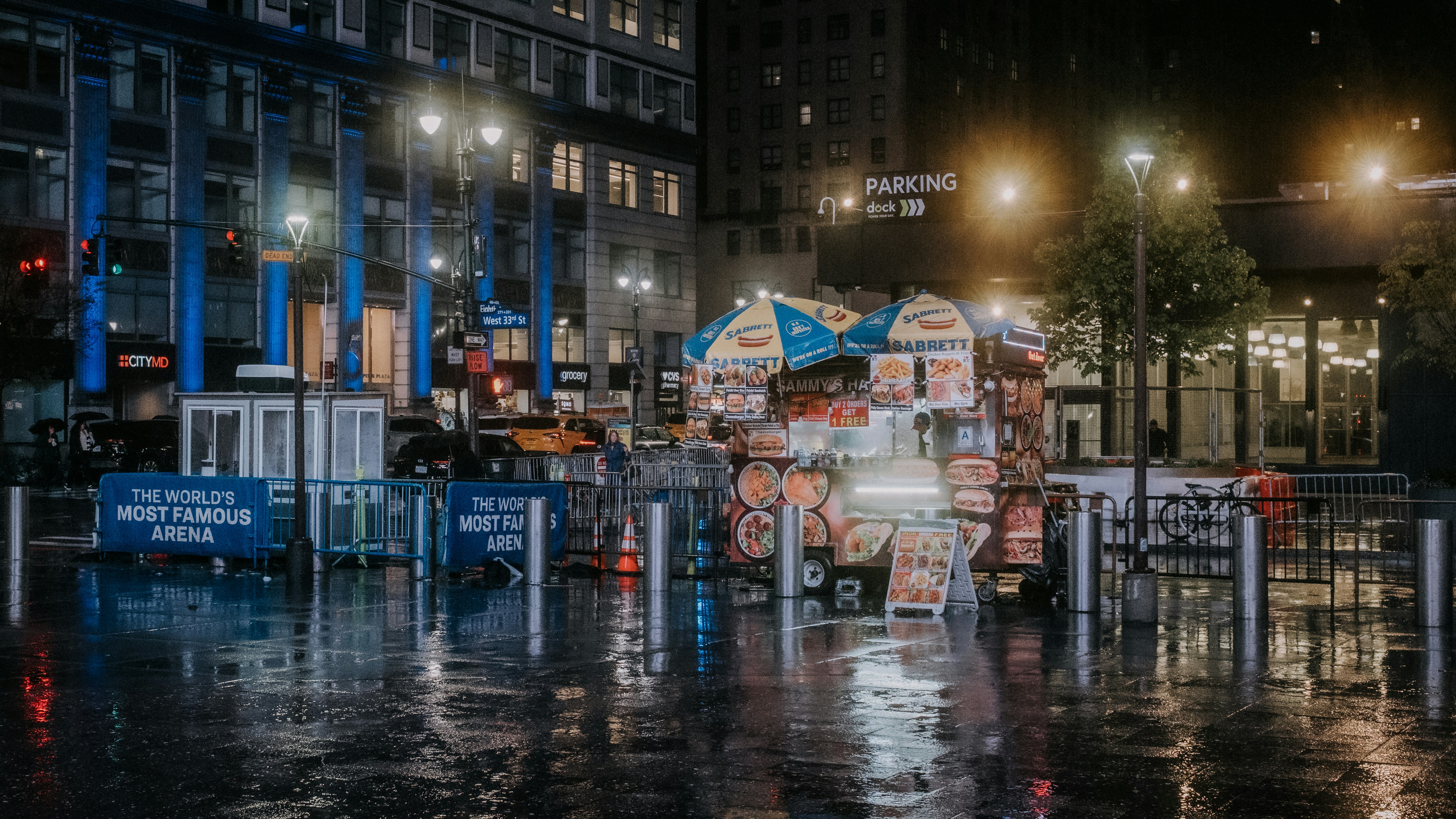 Street food cart at night in rainy city