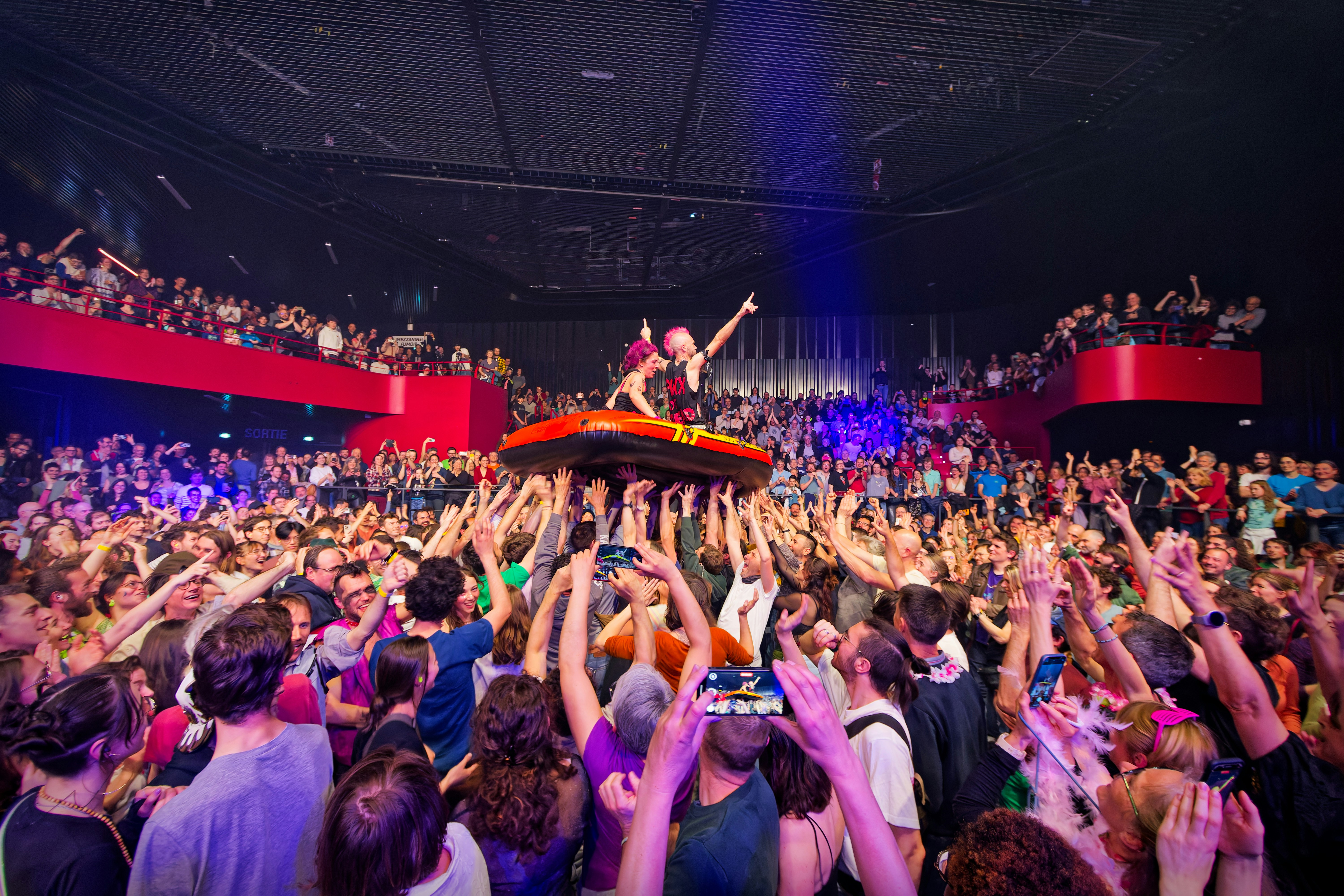 Dj performing for a large crowd at a concert