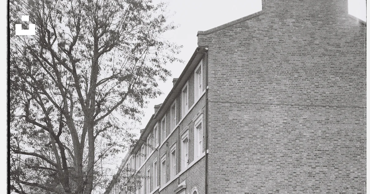 Station wagon parked in front of terraced houses photo – Free ...