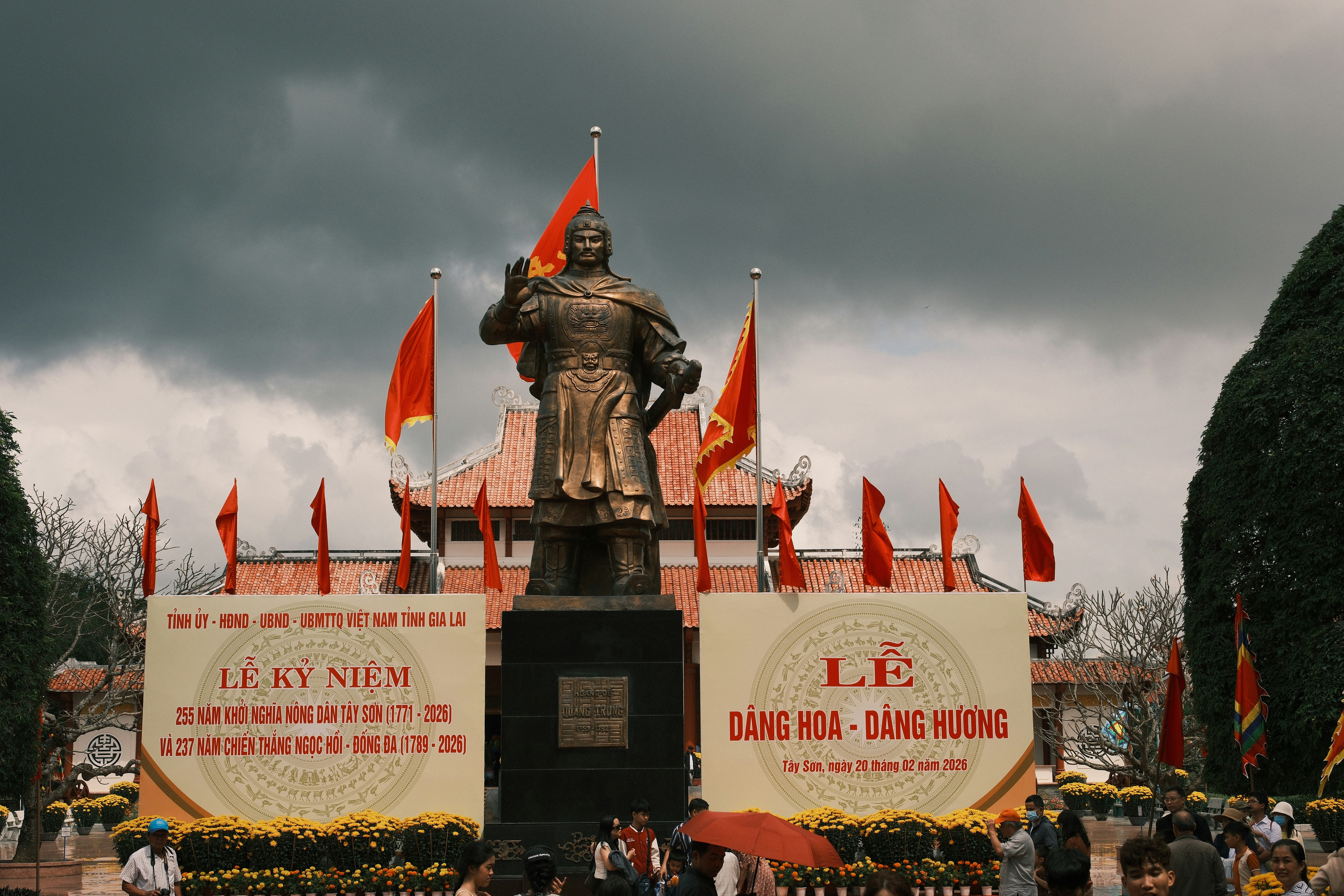 Statue of a man with flags and banners