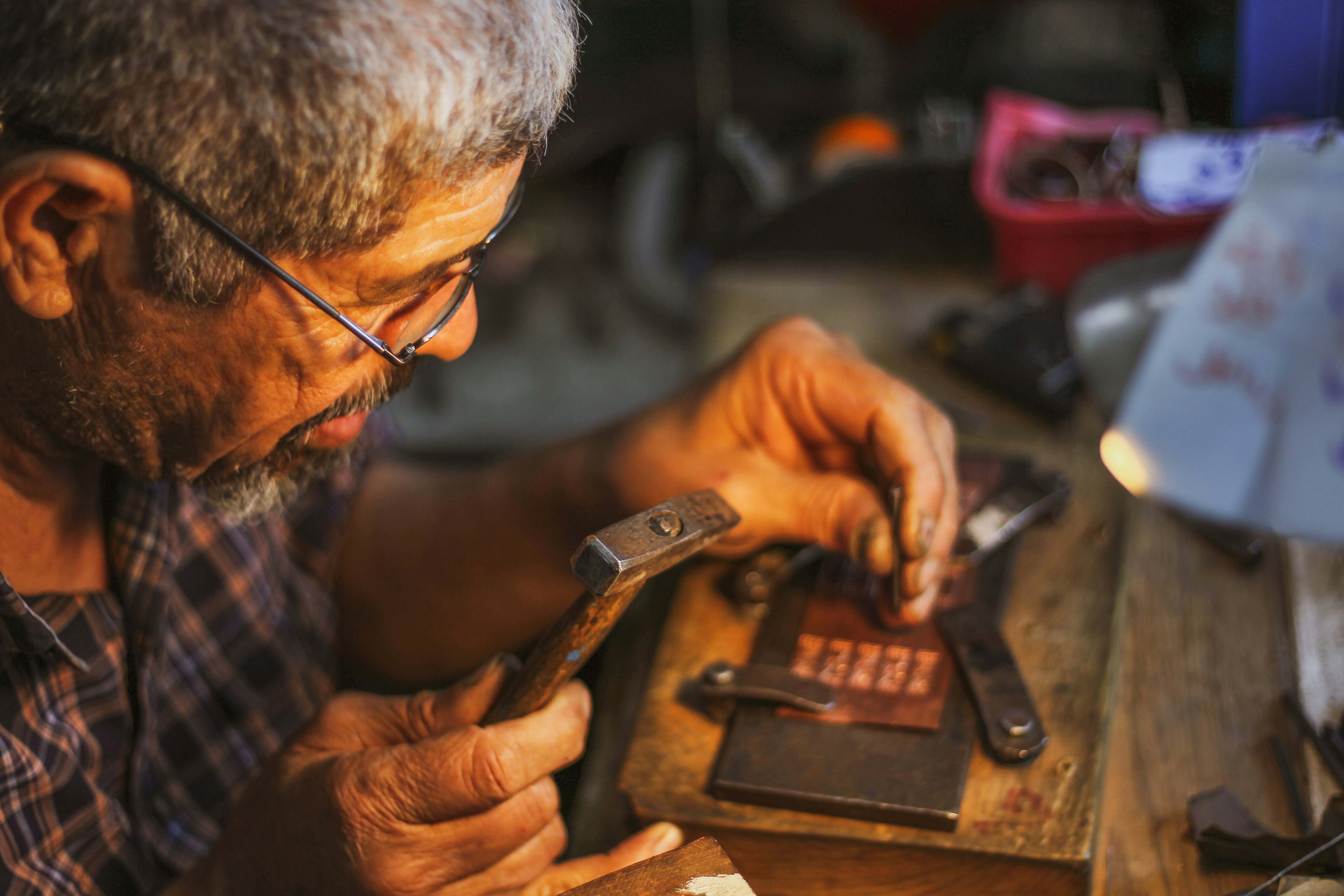 A man crafts souvenirs in Djerbahood, located in Djerba, Tunisia, which carries deep traces of history with its narrow streets, traditional architecture, and historic buildings, captivating its visitors on May 02, 2026.