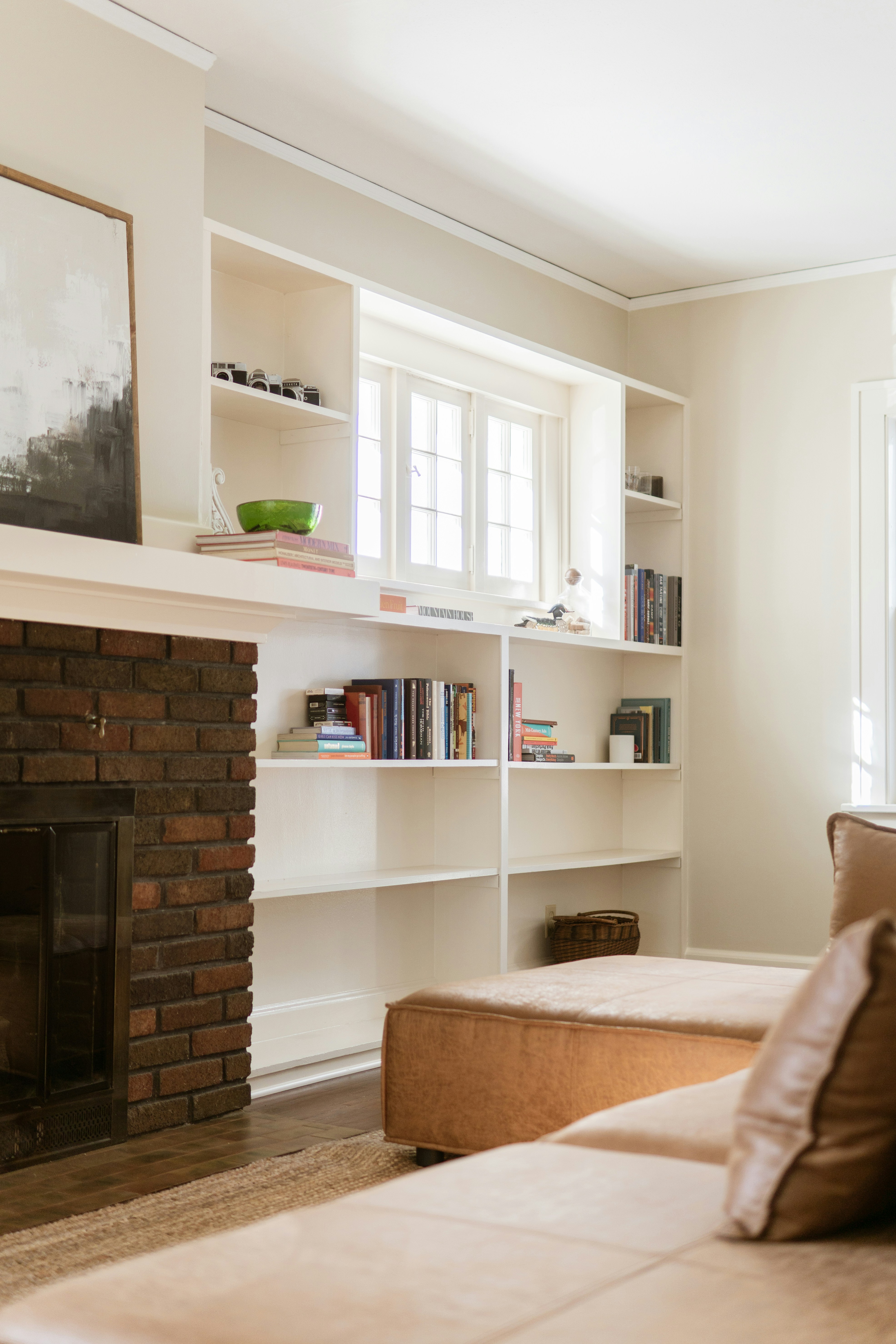 Living room with fireplace and built-in bookshelves